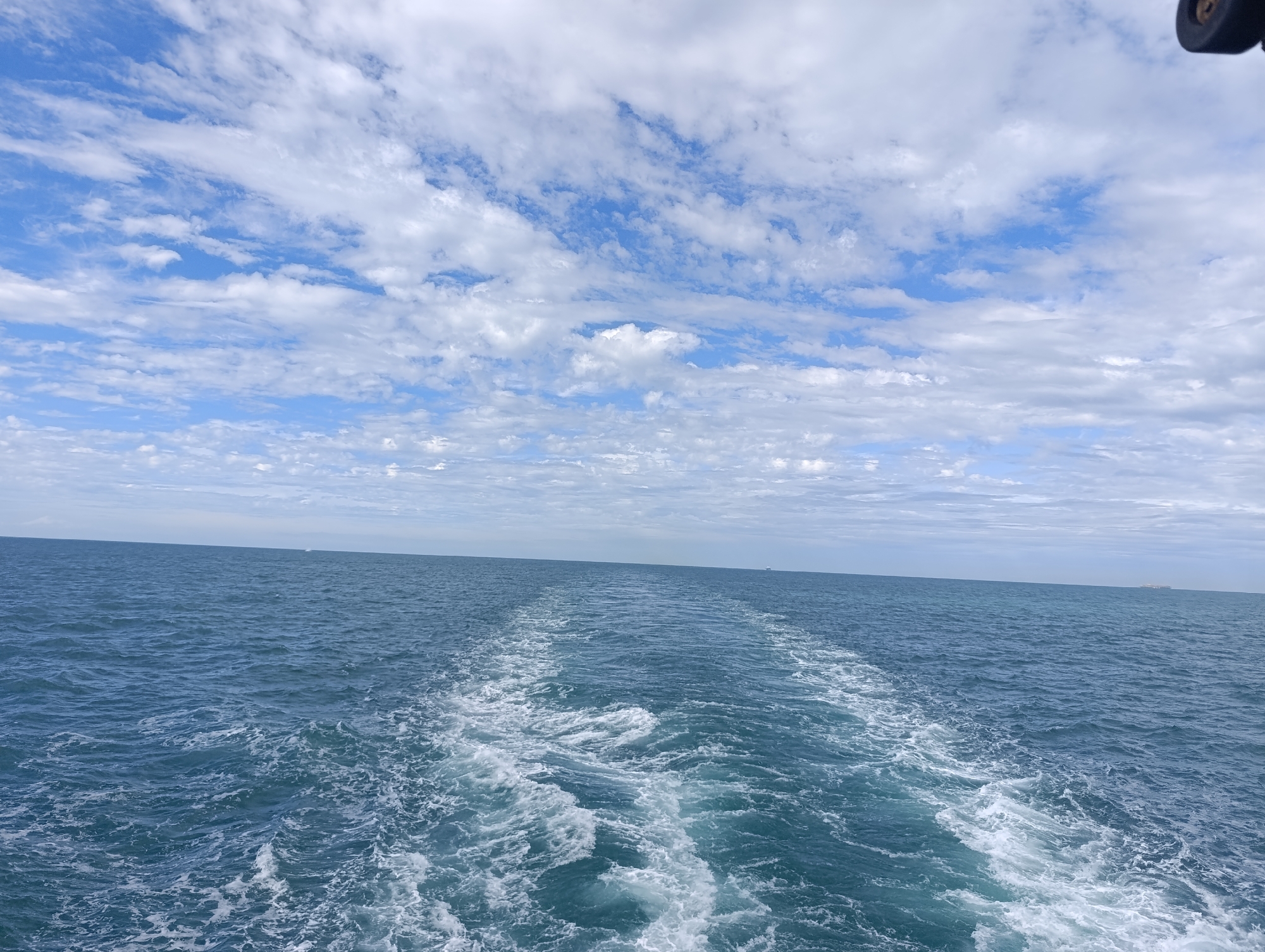 Open ocean wake view from a moving vessel's stern
