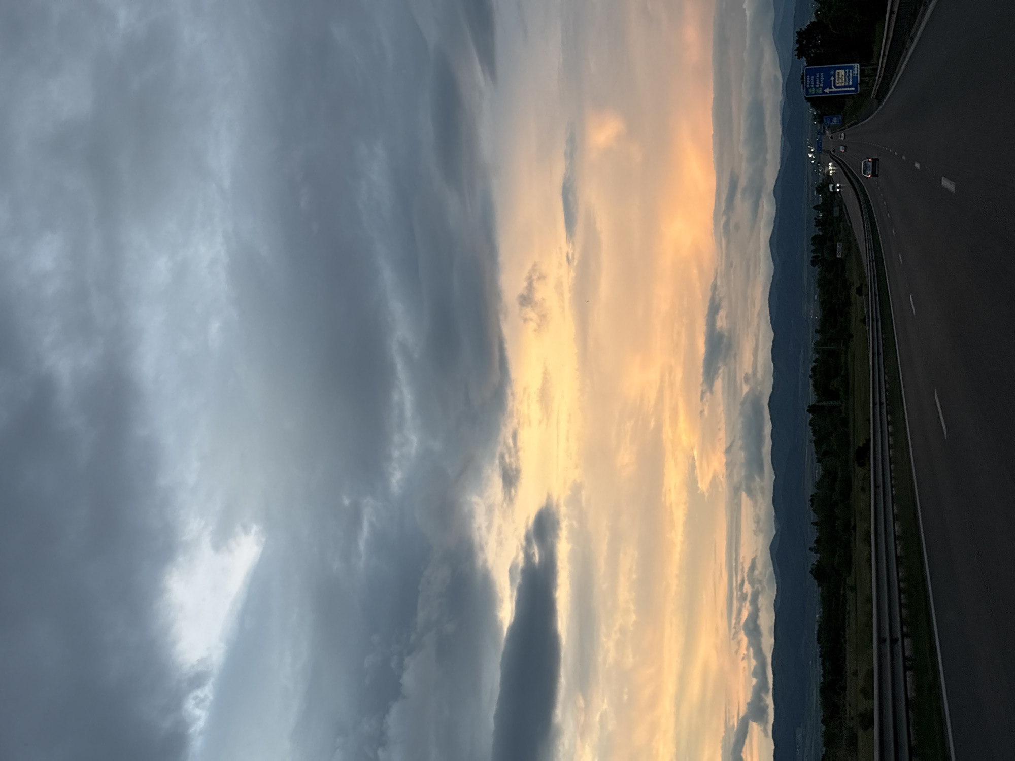 Highway scene captured near Sofia with mountains, dramatic sky