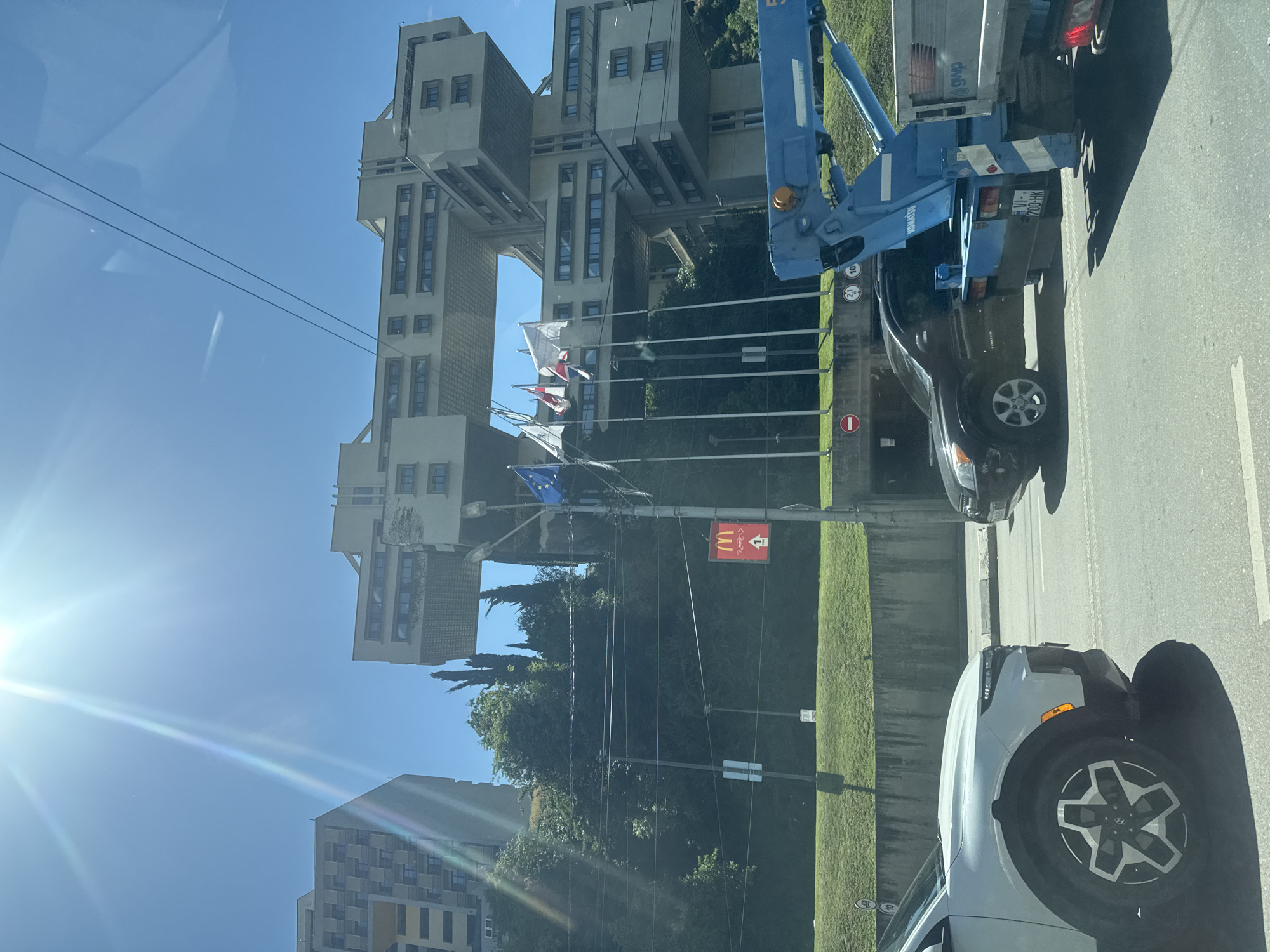 Driver documents sunny morning journey through Tbilisi's Soviet architecture