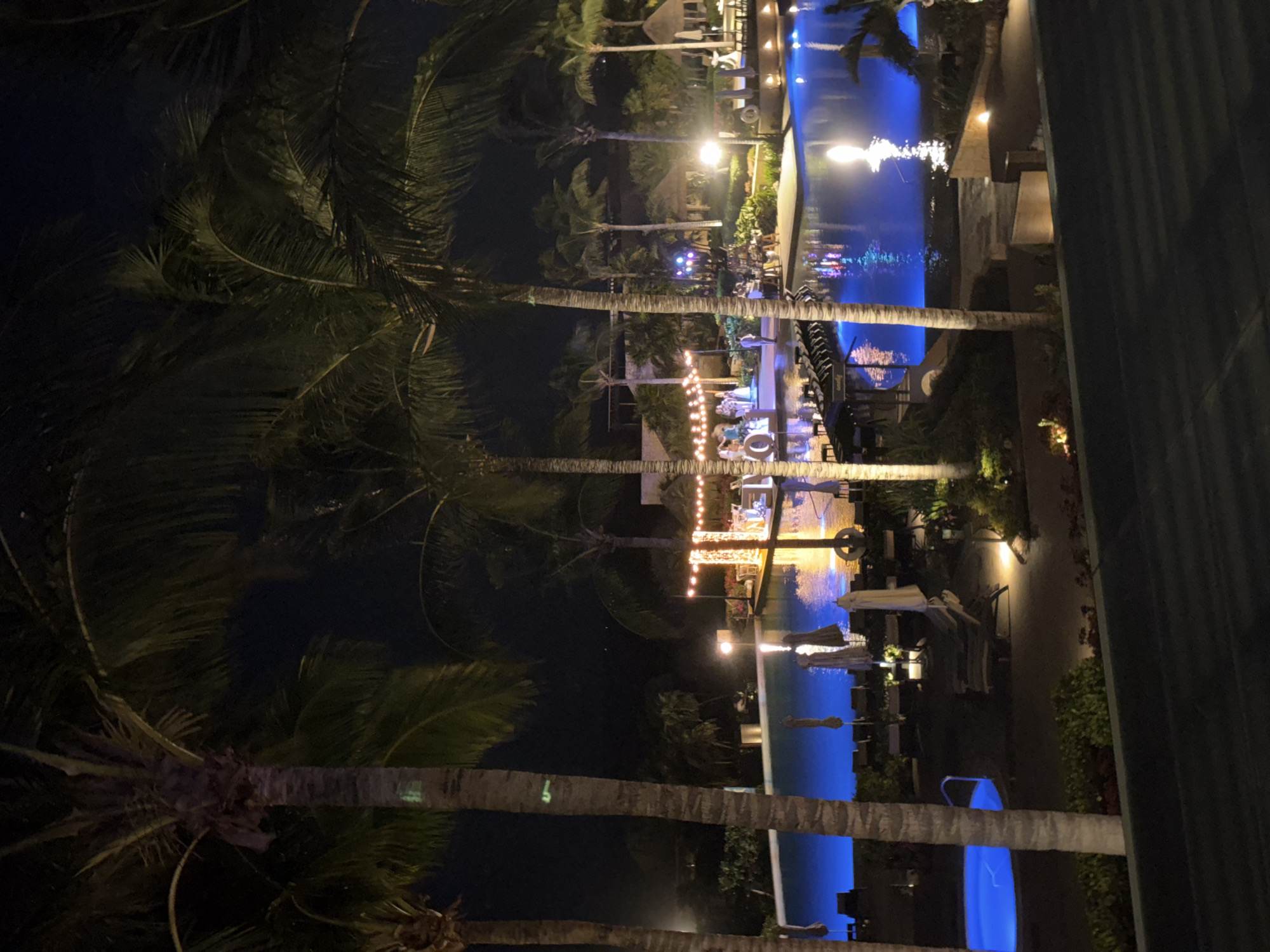 Late-night resort stay in Punta Sam with dining, drinks, and pool views