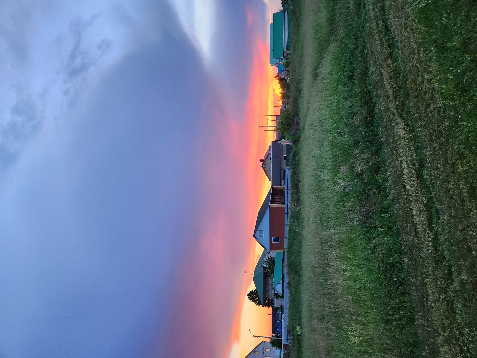 Family evening by Russian riverside with rainbows and strawberry treats