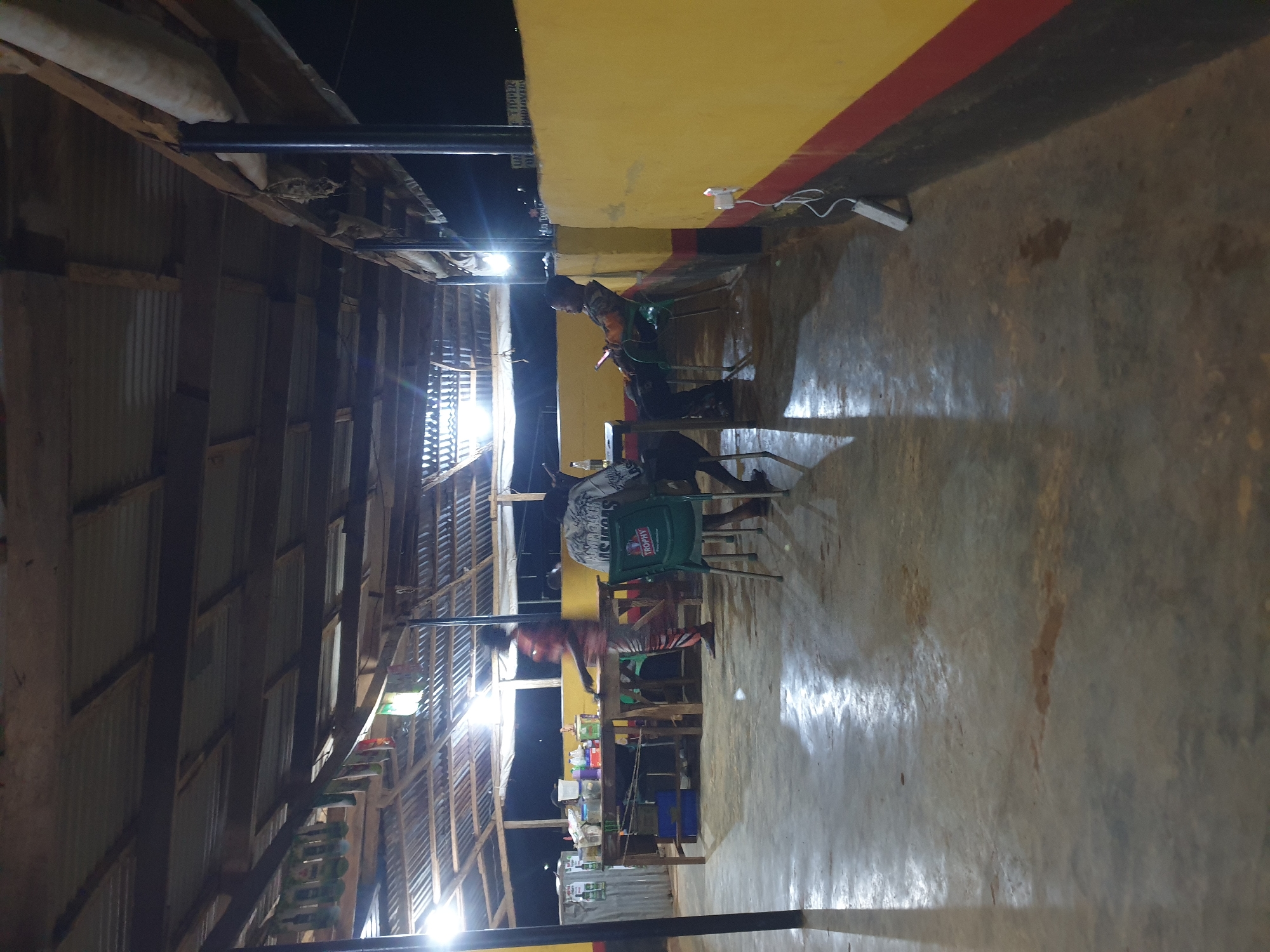 Evening social gathering documented at outdoor venue in Nigeria
