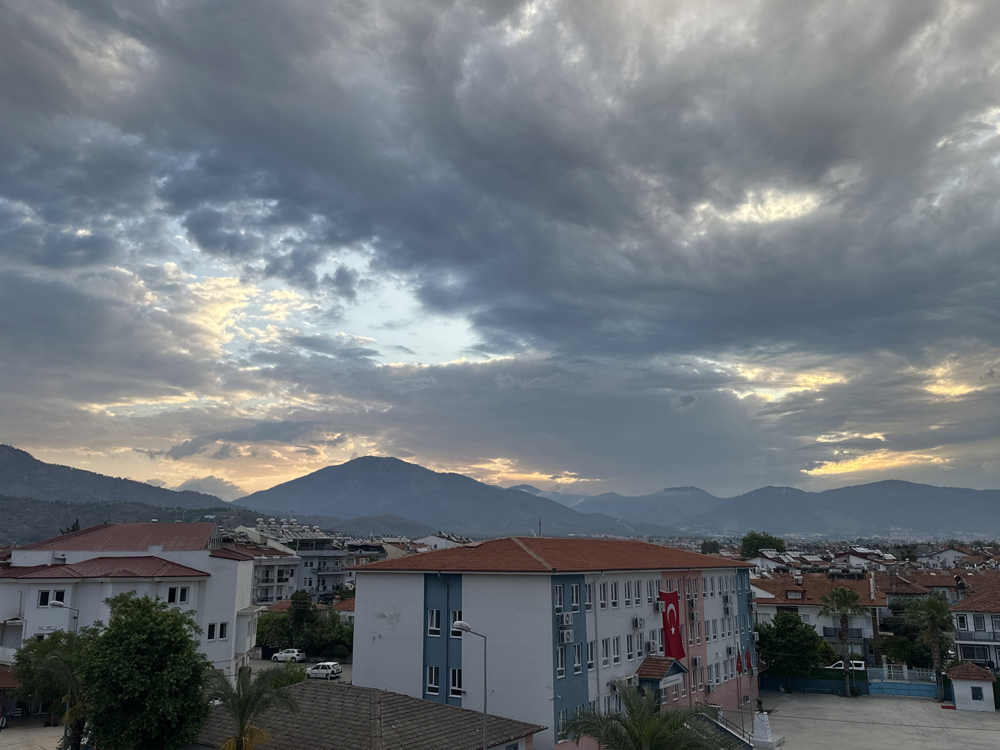 Dawn breaks over red rooftops in Fethiye, Turkey
