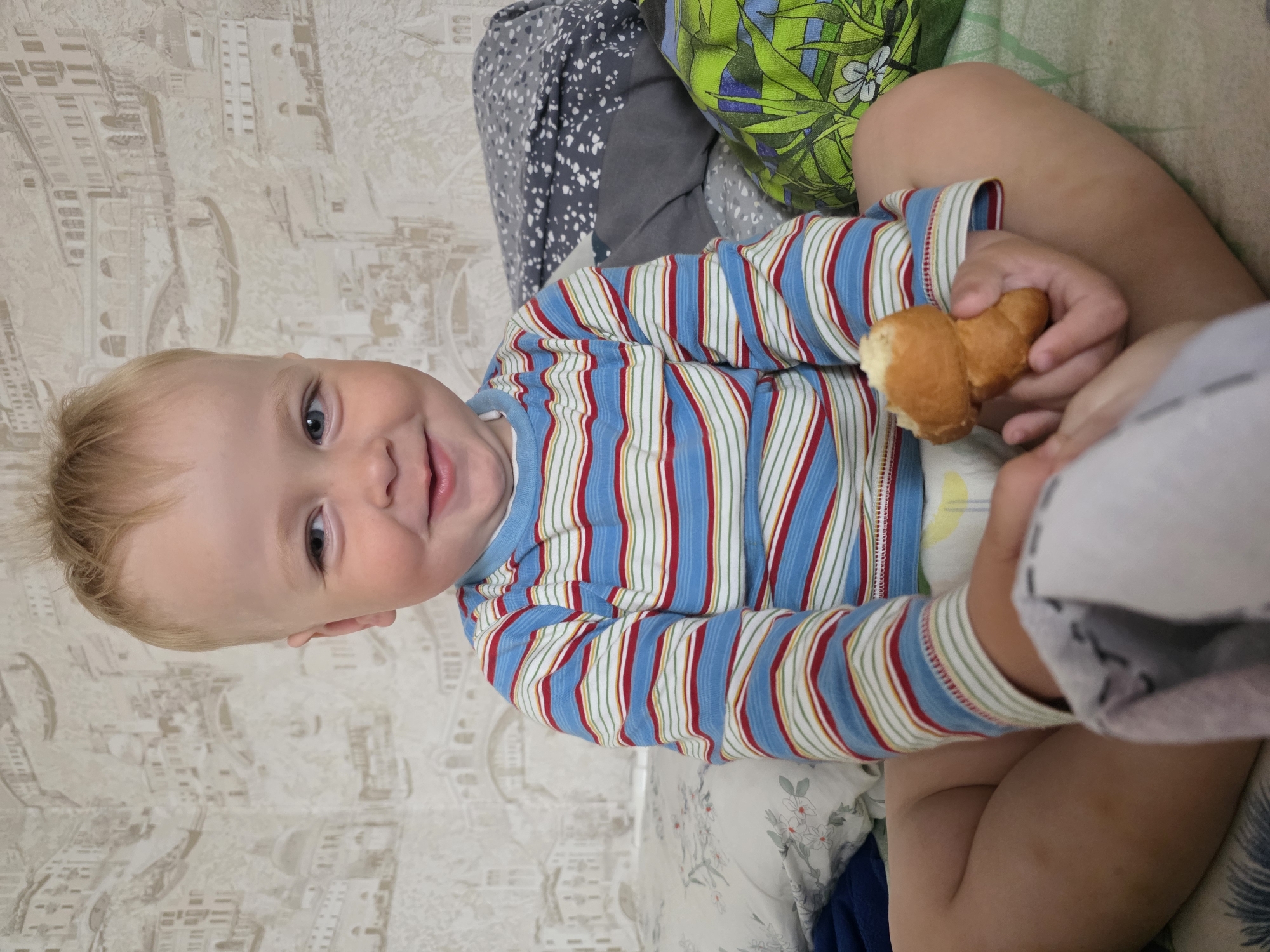 Toddler's smile and rainy garden captured in morning moments