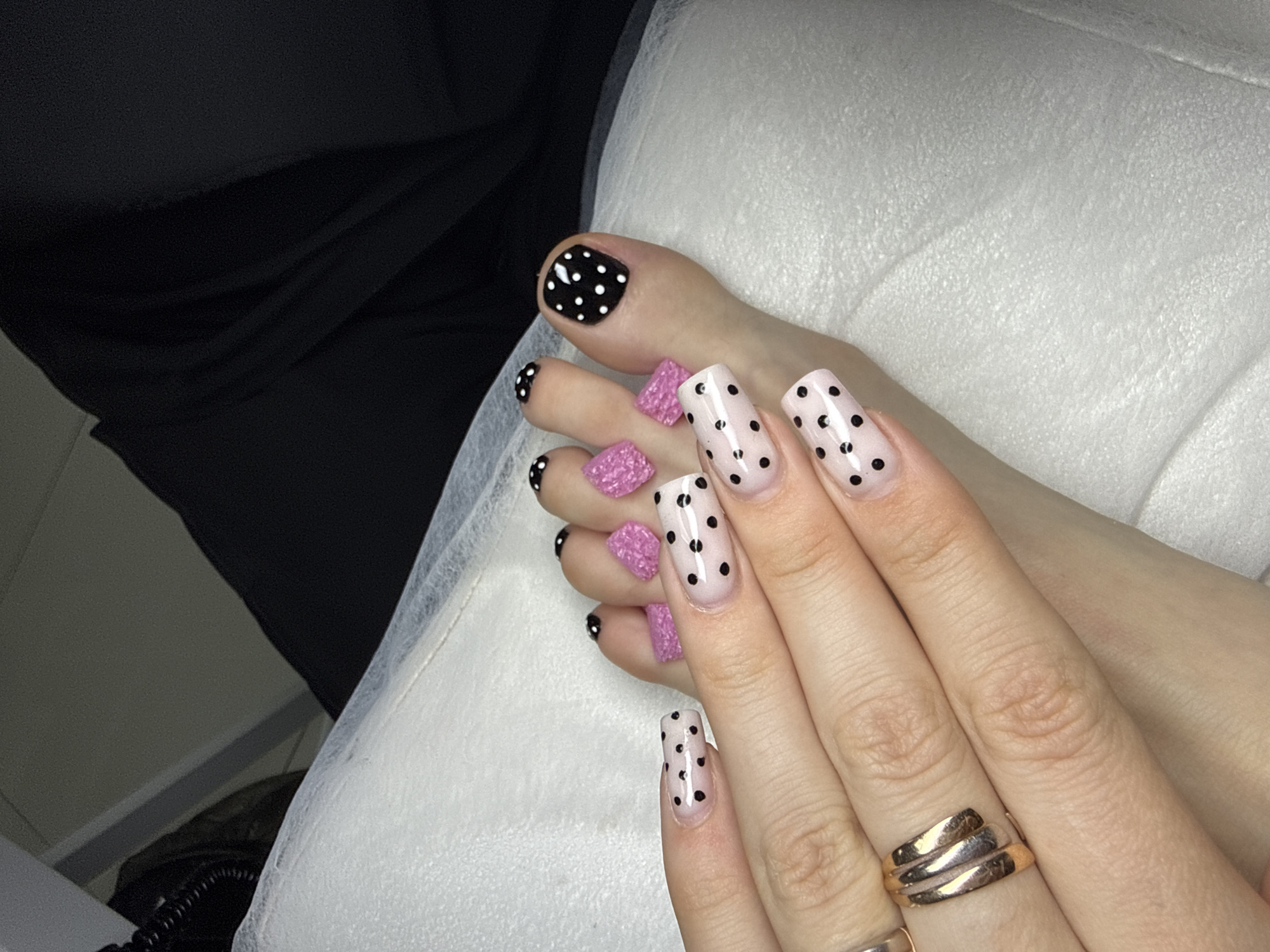 Pink polka dot manicure displayed in Batumi, Georgia