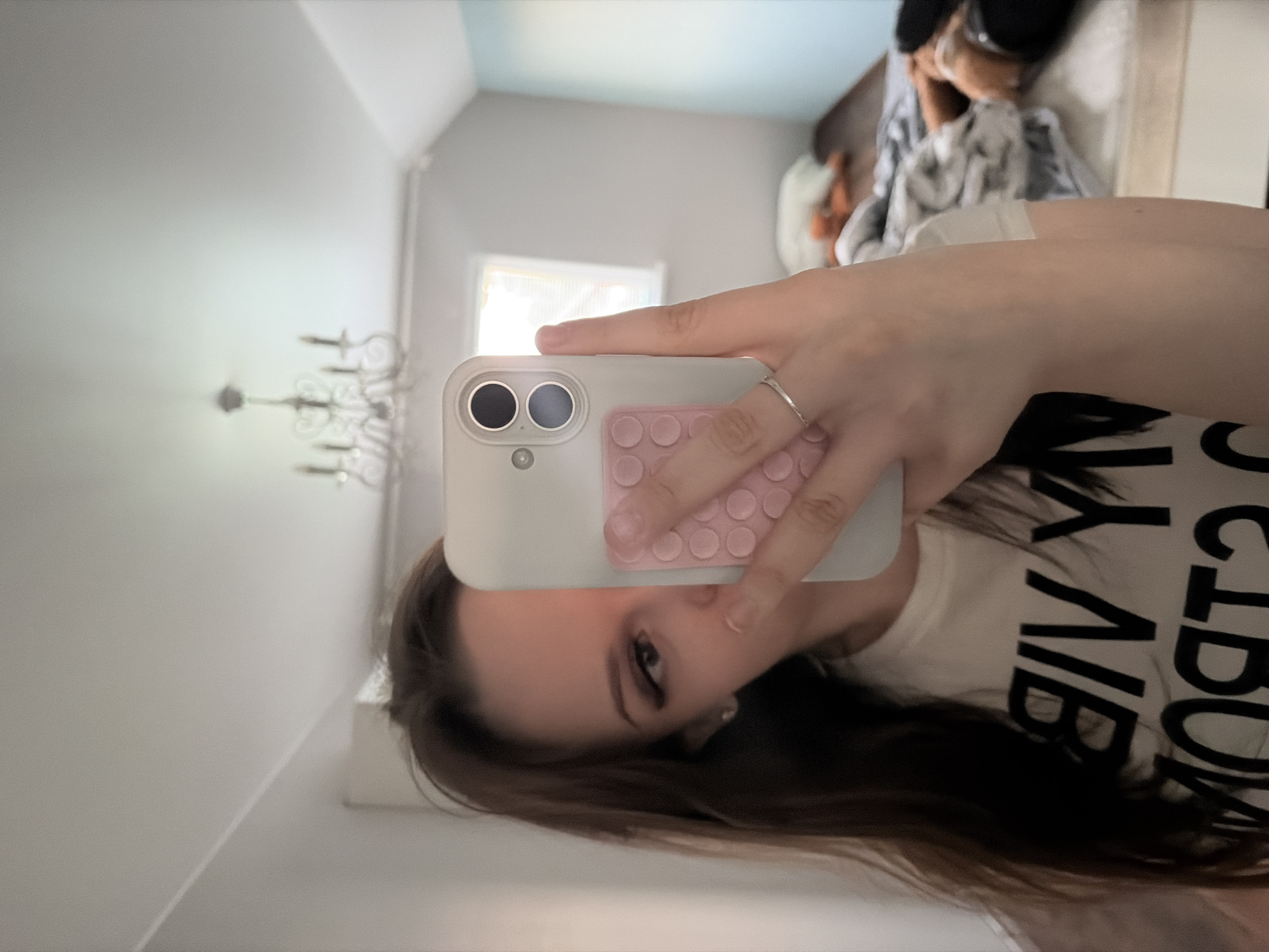 Woman takes multiple mirror selfies in Semyonov, Russia bedroom