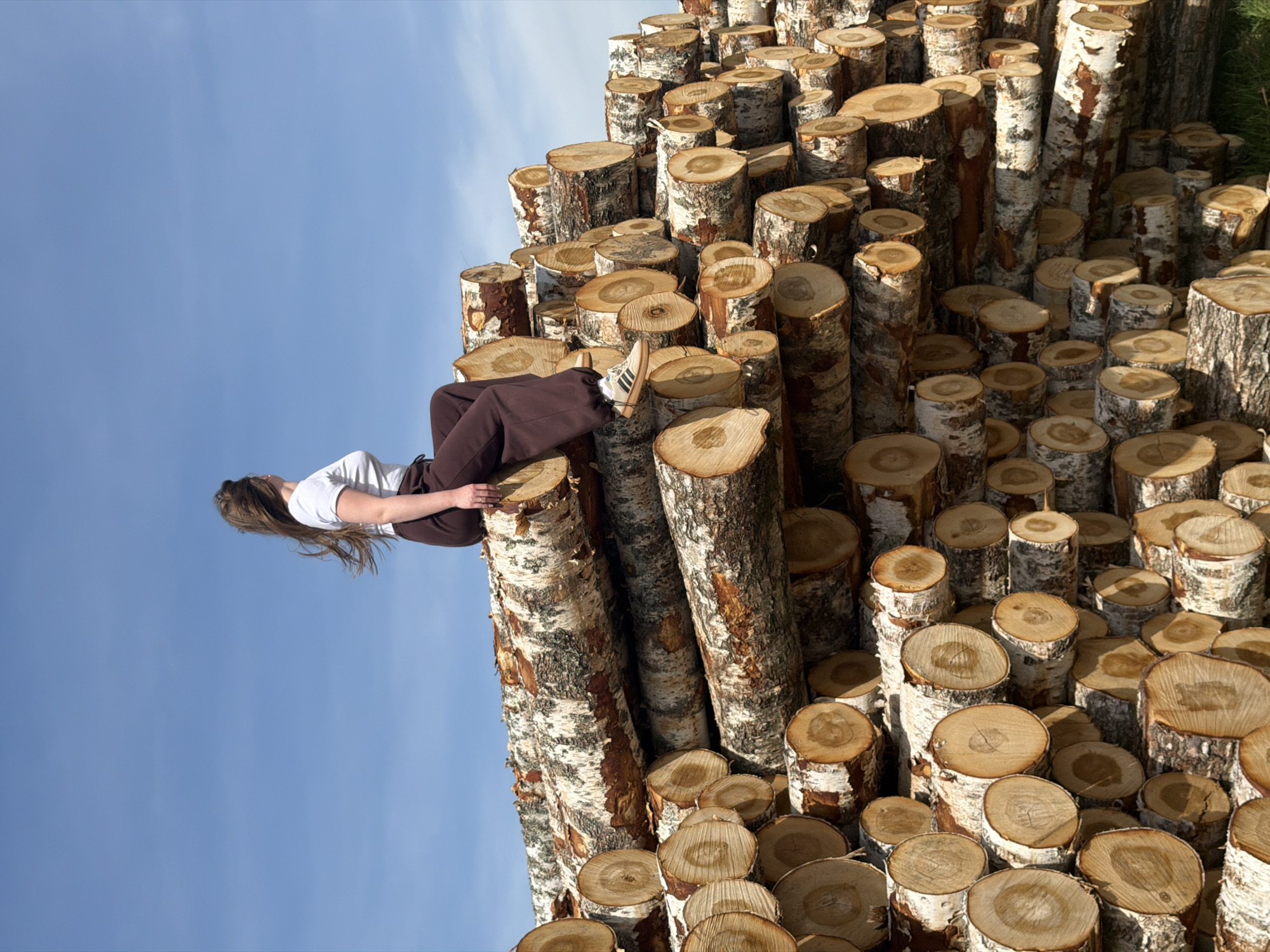 Woman photographed among birch trees in Russian countryside