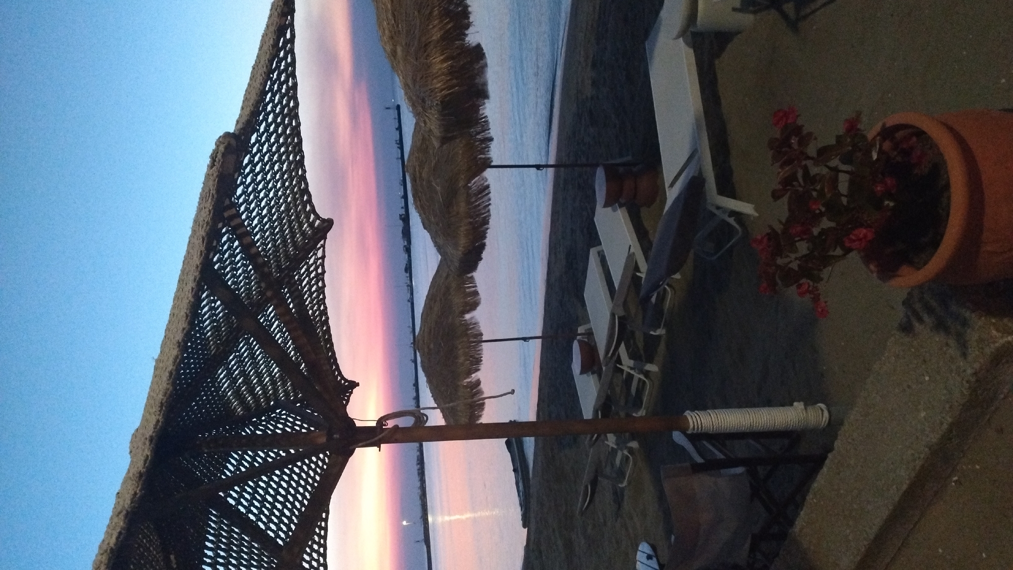 Dusk settles over a beach resort in Neoi Epivates, Greece