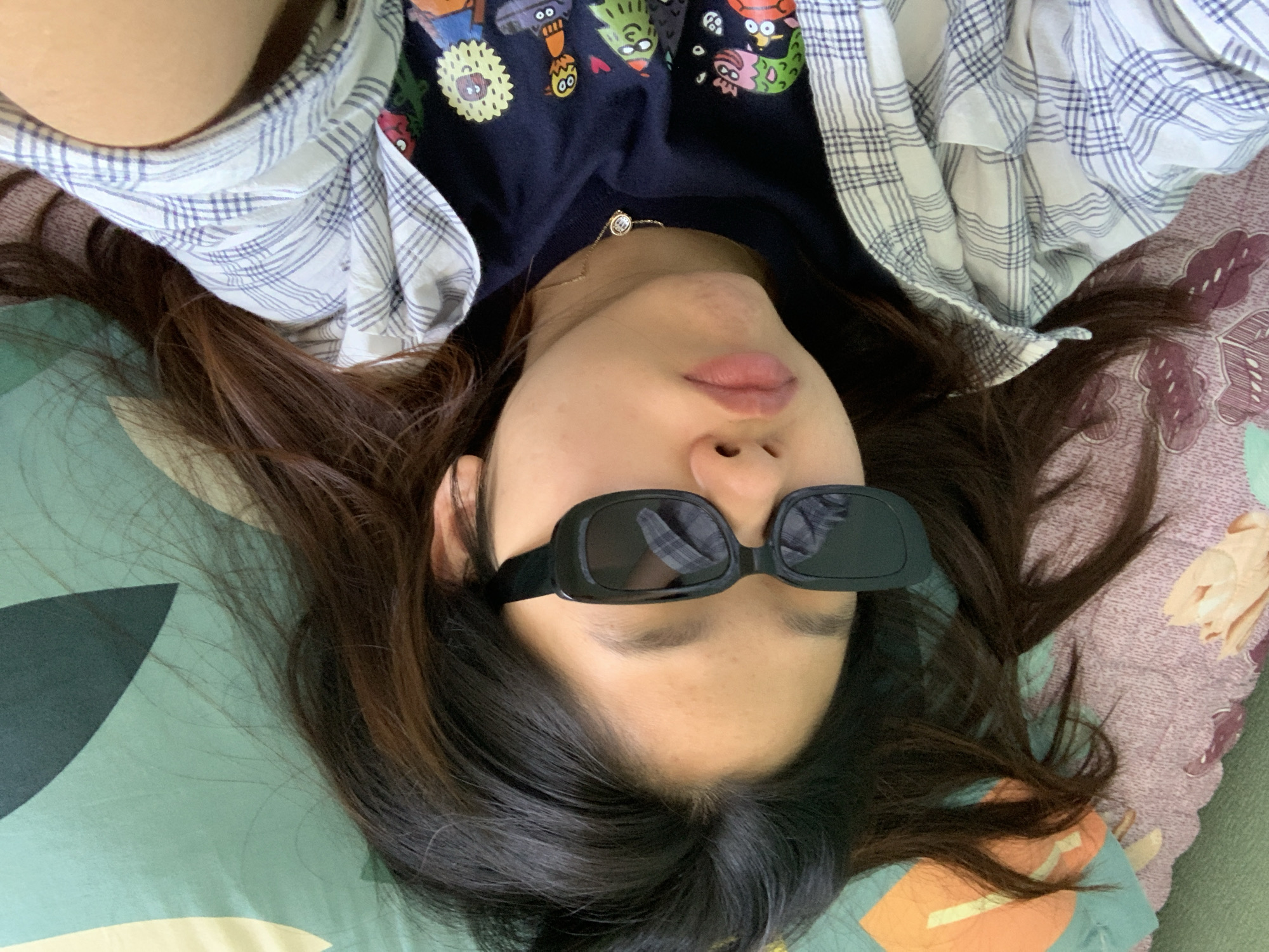 Relaxed indoors on a bed in Tashkent.