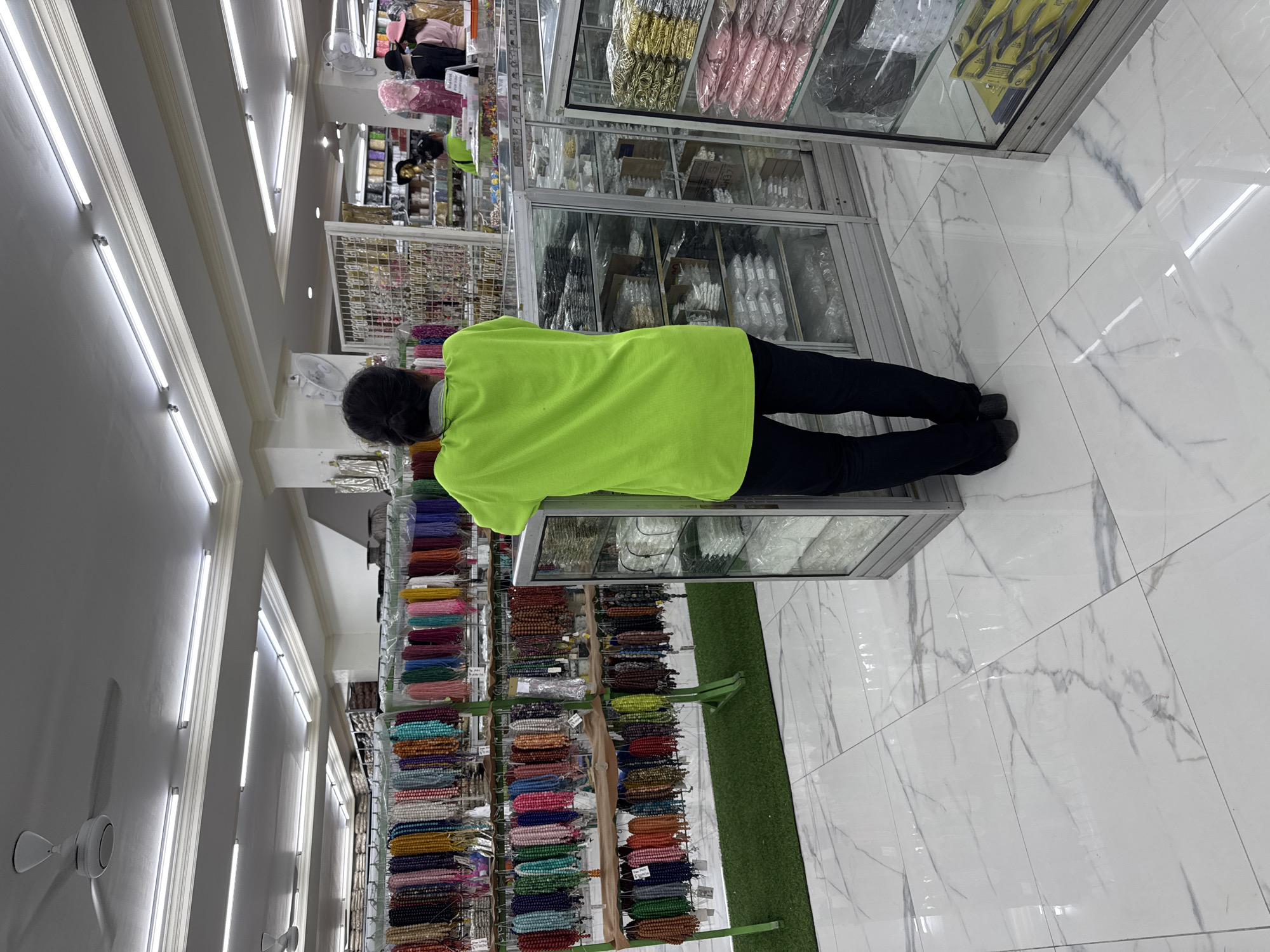 Customer shops in Kuta retail store during morning hours