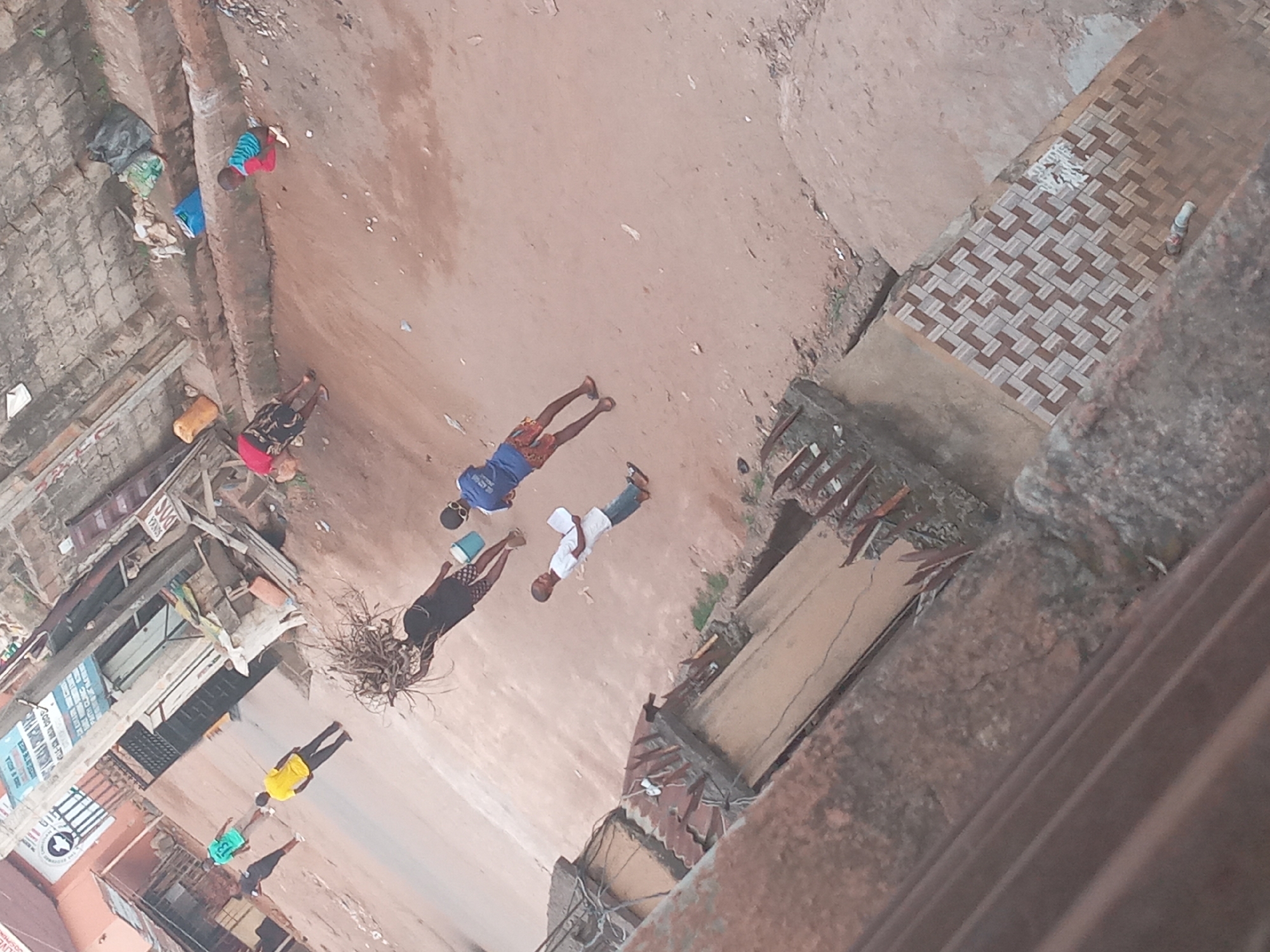 Urban street scene captured from elevated angle shows pedestrians