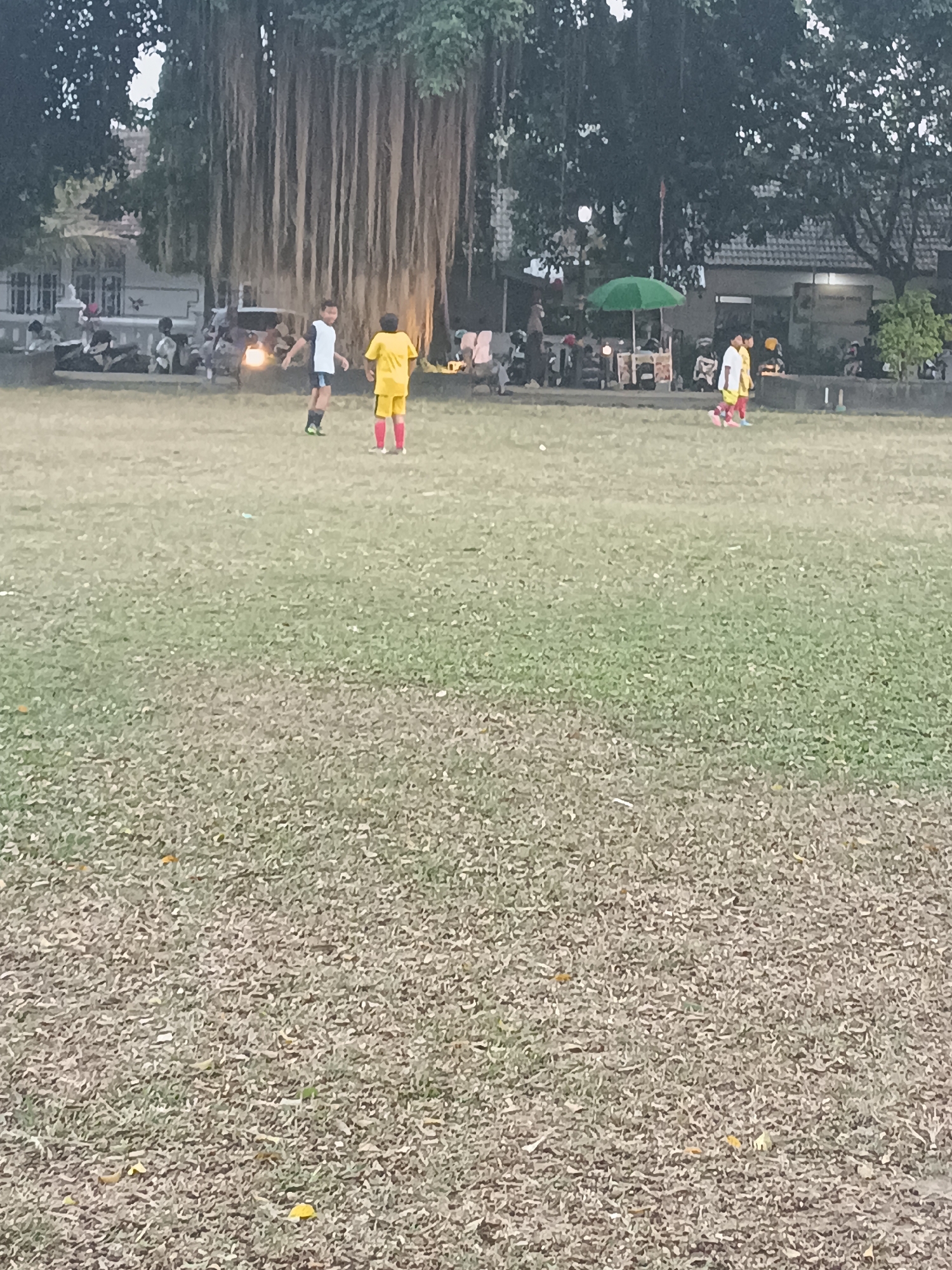 Youth soccer match and street life in Sleman, Indonesia
