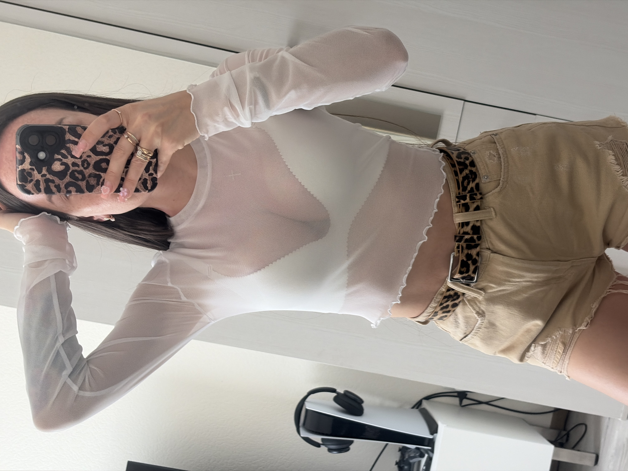 Woman Takes Mirror Selfie in Bedroom