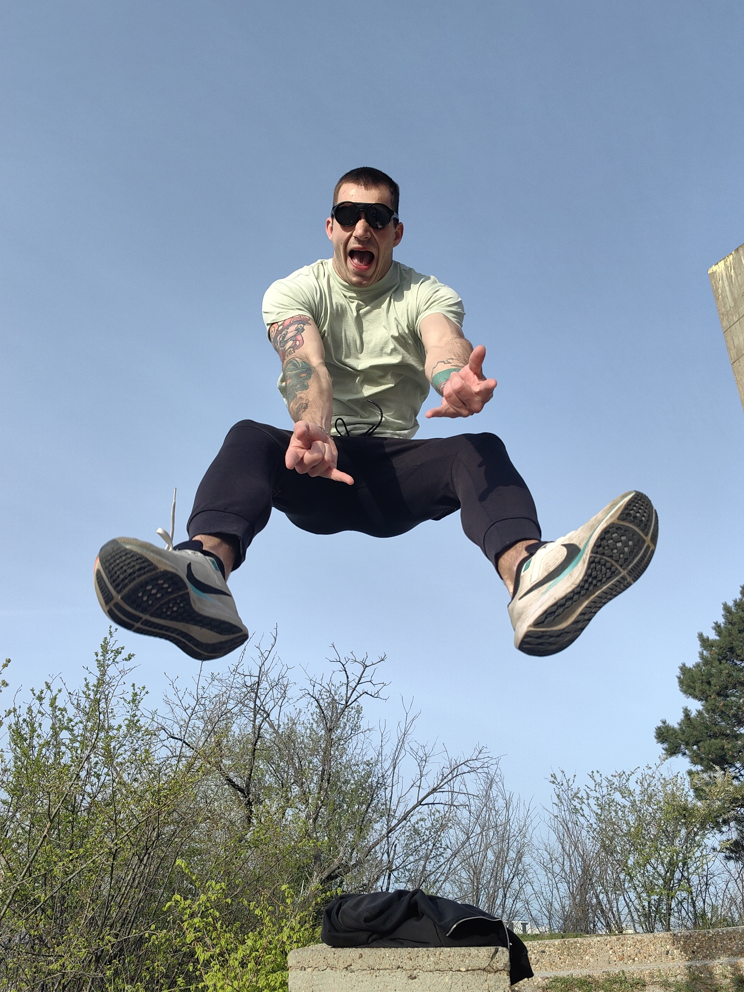Man captured jumping against blue sky in Varna, Bulgaria