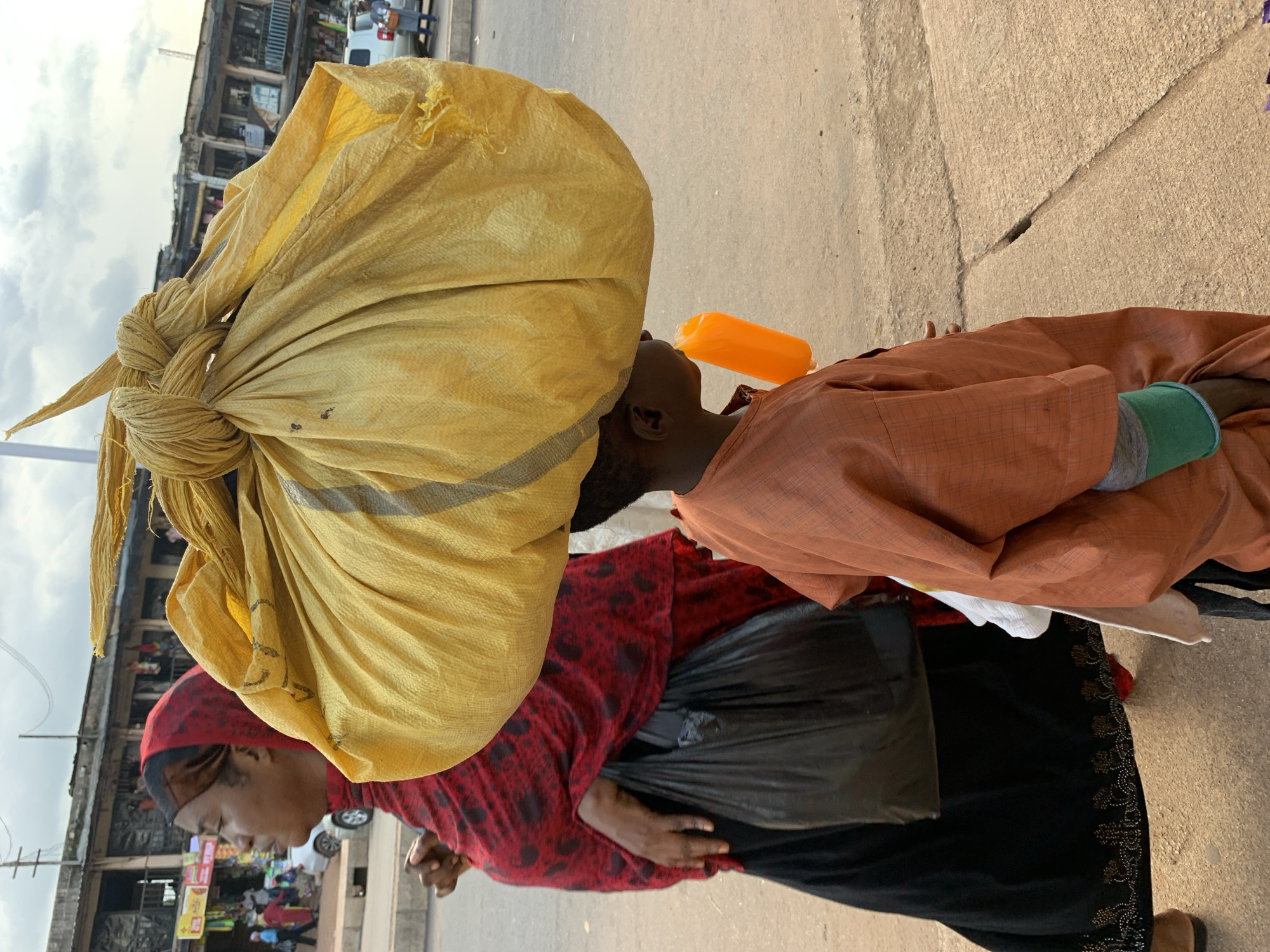 Jos market street buzzing with vendors and foot traffic