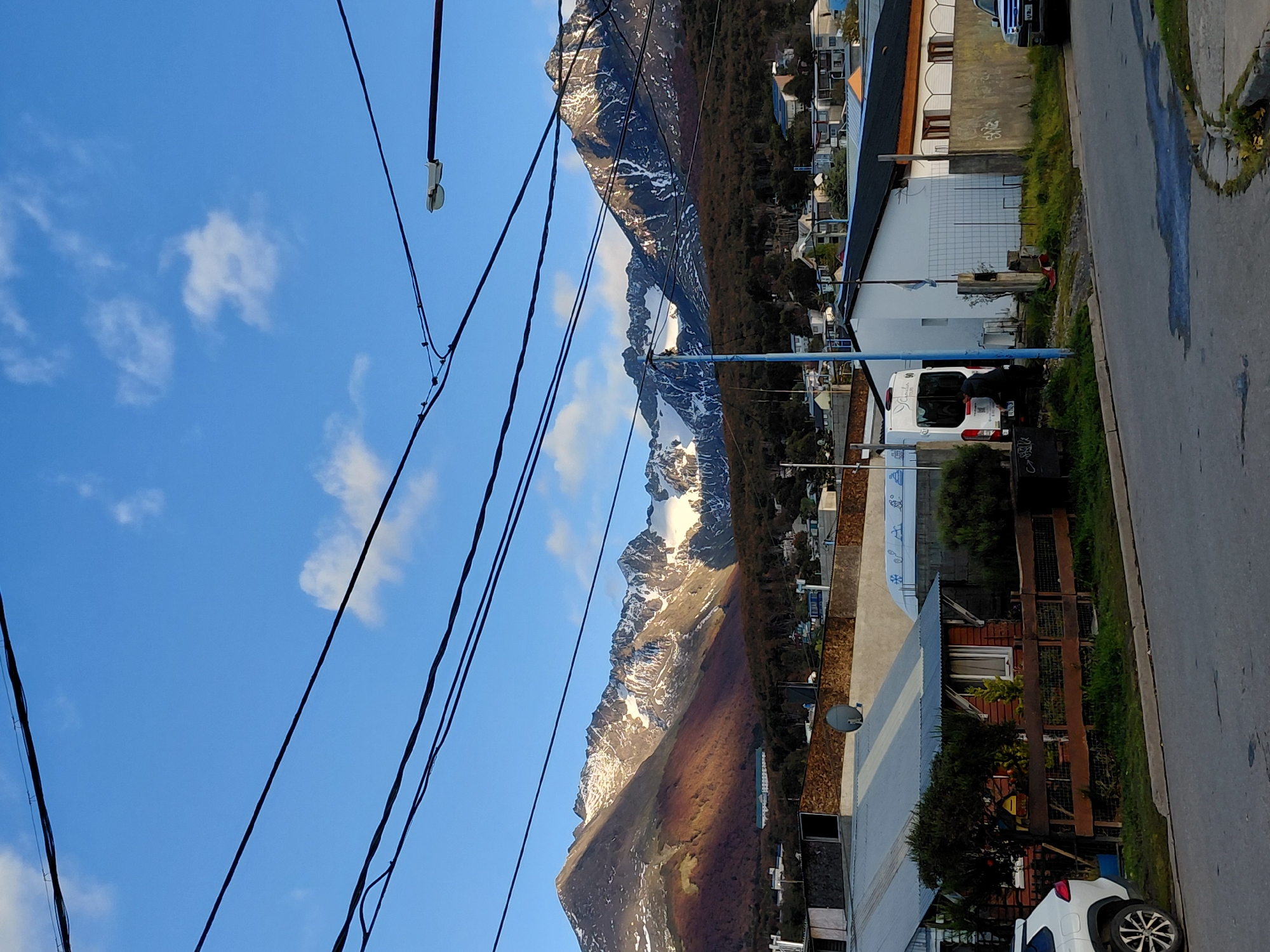 Street scene captured in Ushuaia with mountain backdrop