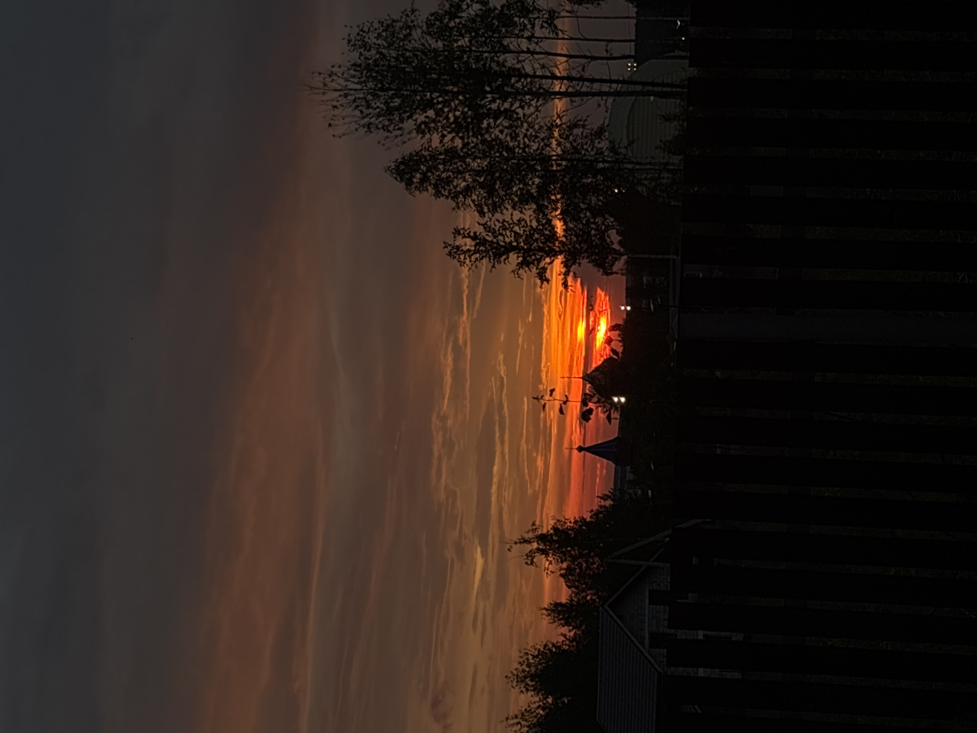 Sunset gathering on wooden deck in Gubakha, Russia