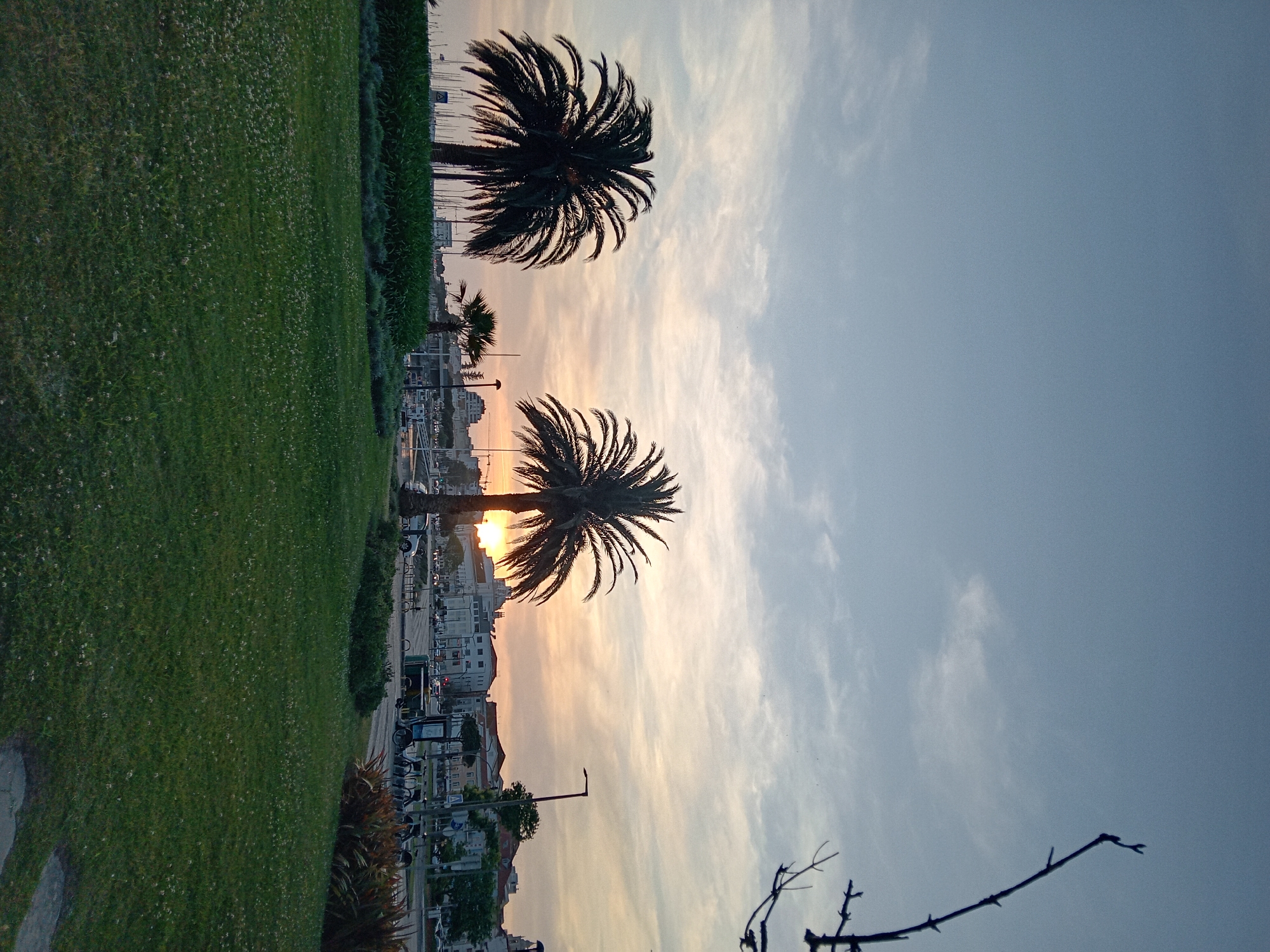 Unknown witness captures sunset marina scenes in unidentified coastal city