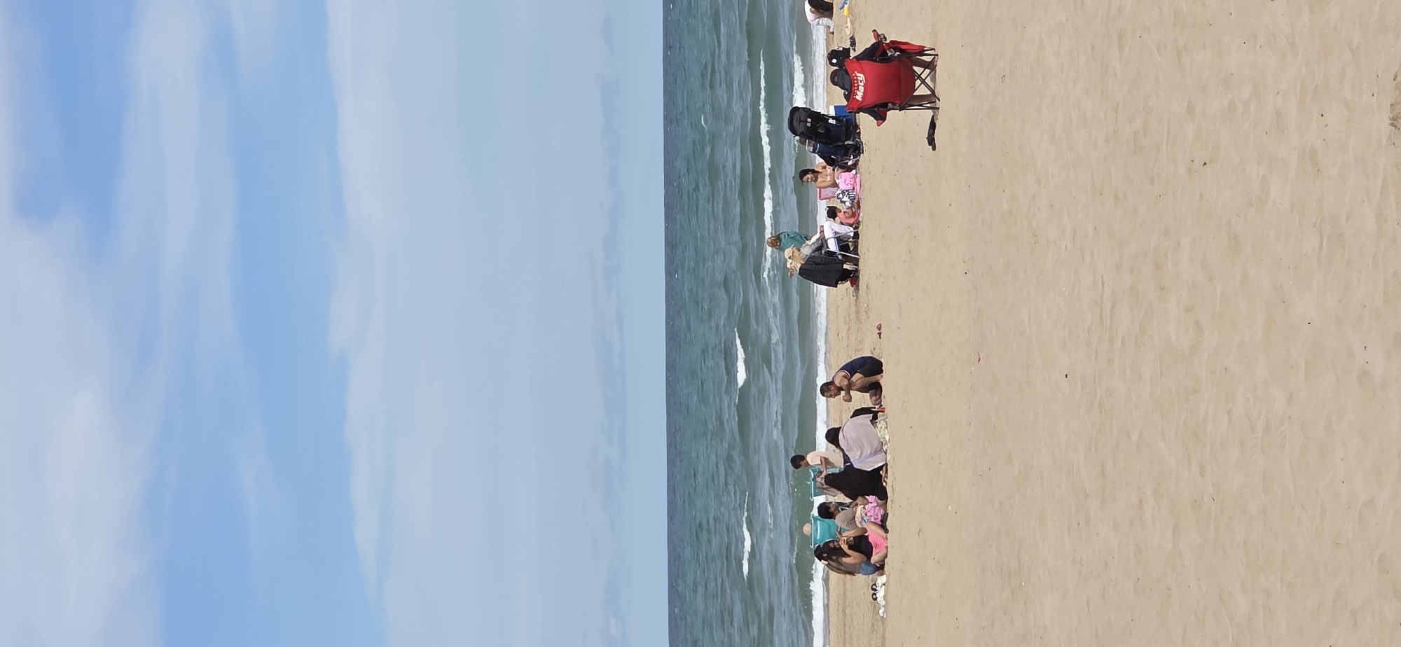Beach activities captured along Sagunto coastline during afternoon hours