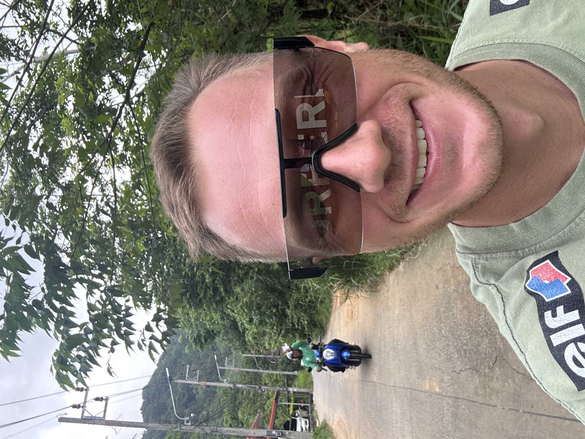 A roadside pause in Rawai with cars, palms, and selfies
