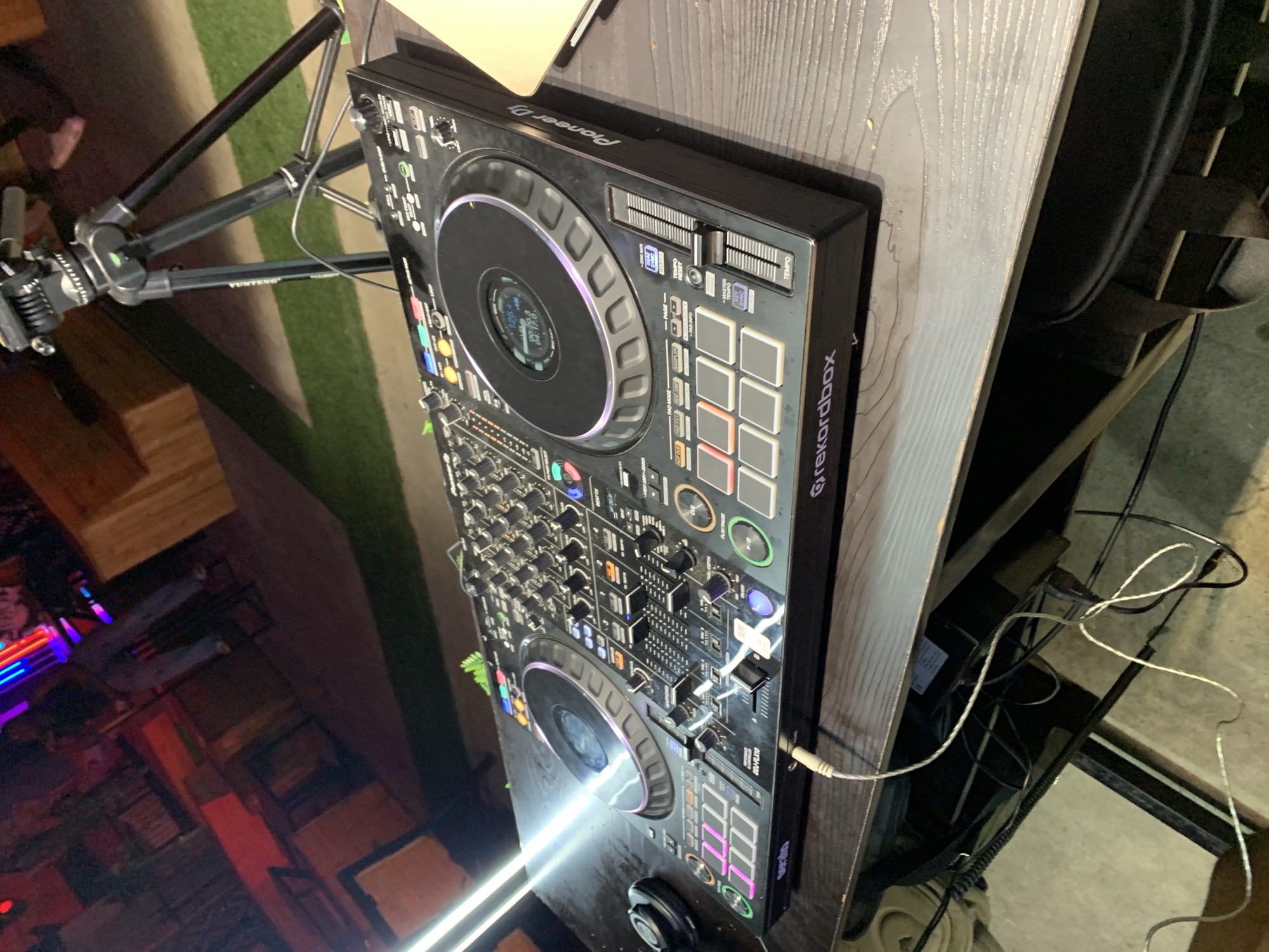 Outdoor nighttime DJ event draws dancers and drinkers
