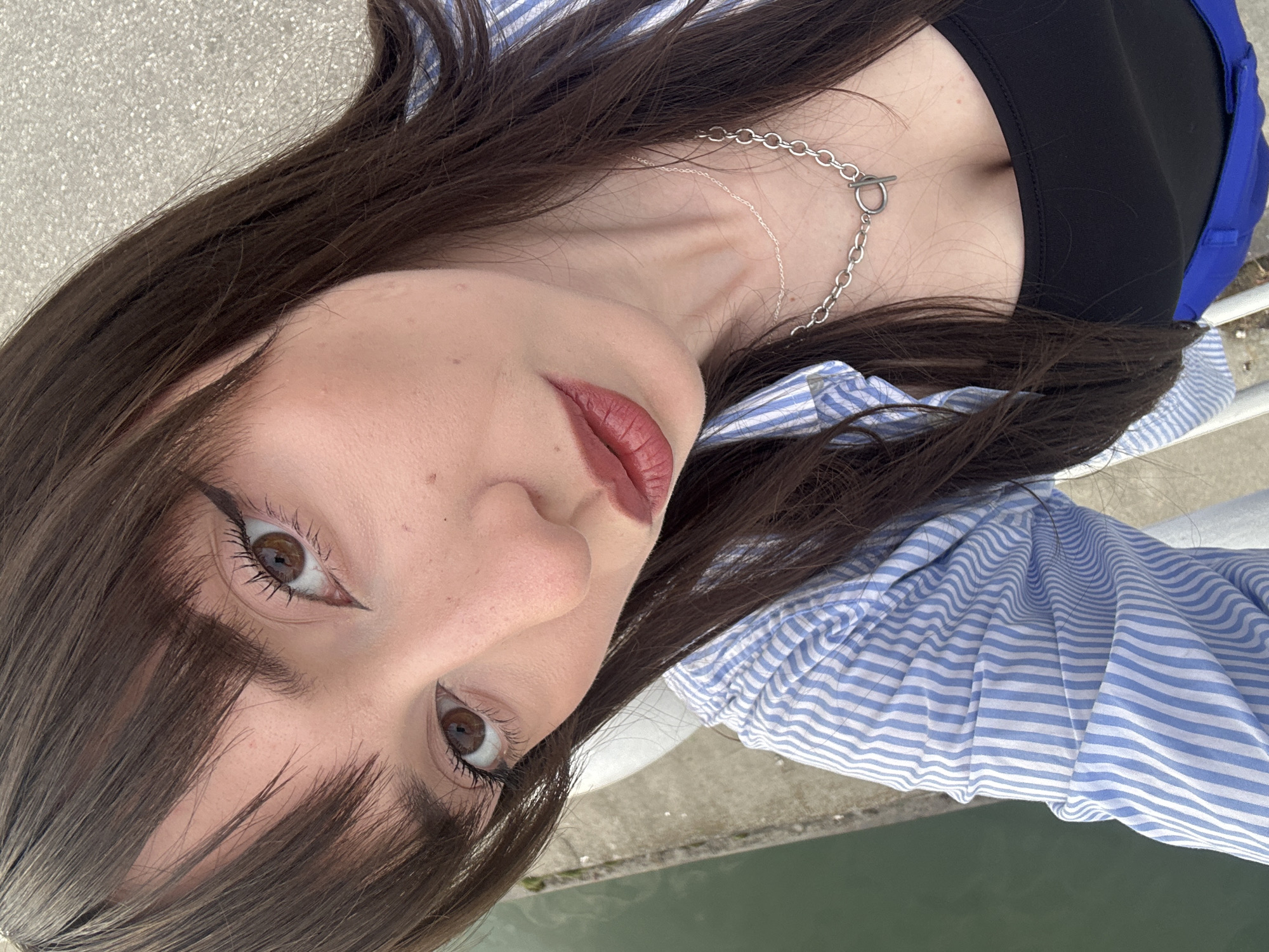 Woman takes selfies near Belgrade's Sava River waterfront