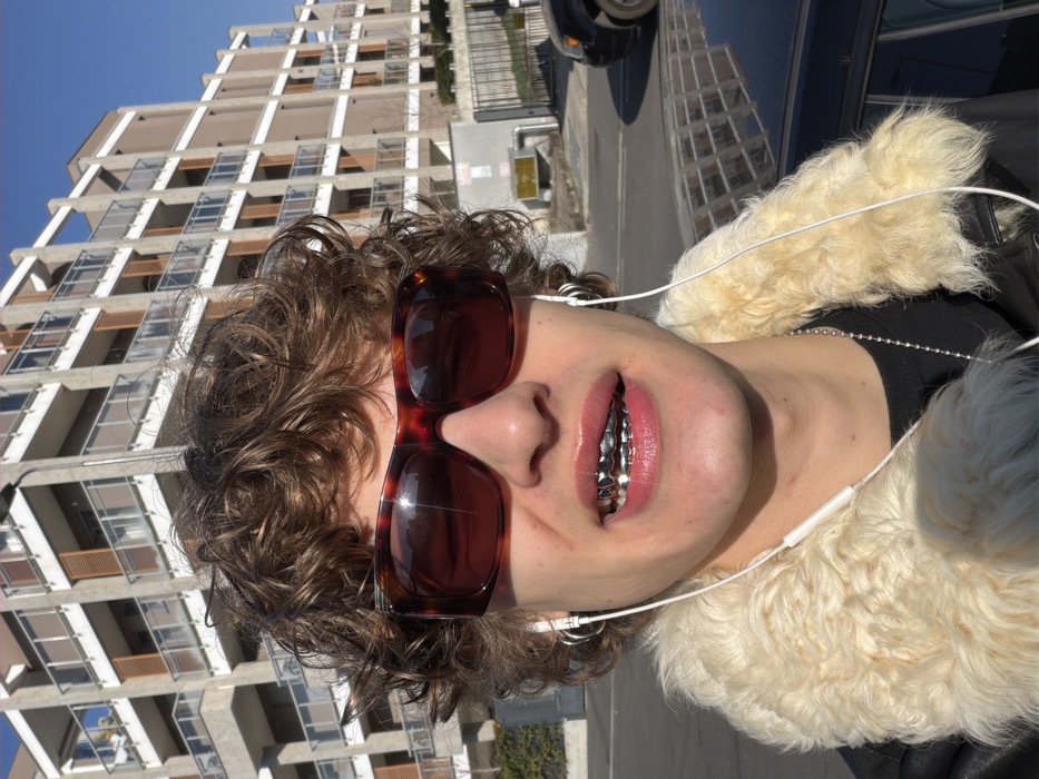 Young man spotted in sunny Milan wearing tortoiseshell sunglasses
