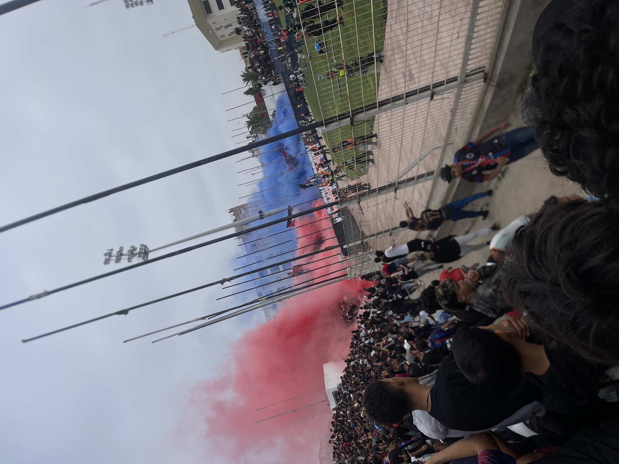 Football fans gather with flags and flares at Safi stadium