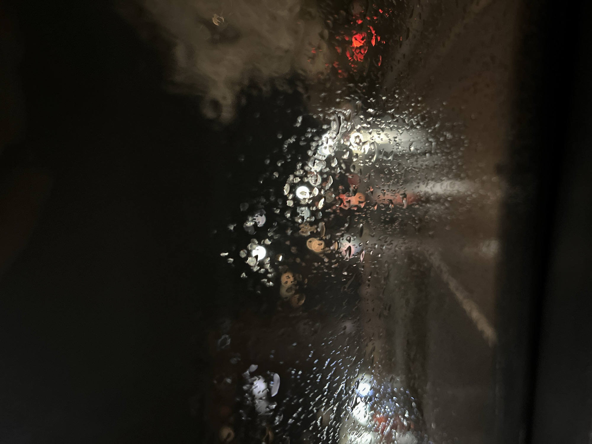 Driver uses GPS navigation during rainy evening in Montana, Bulgaria