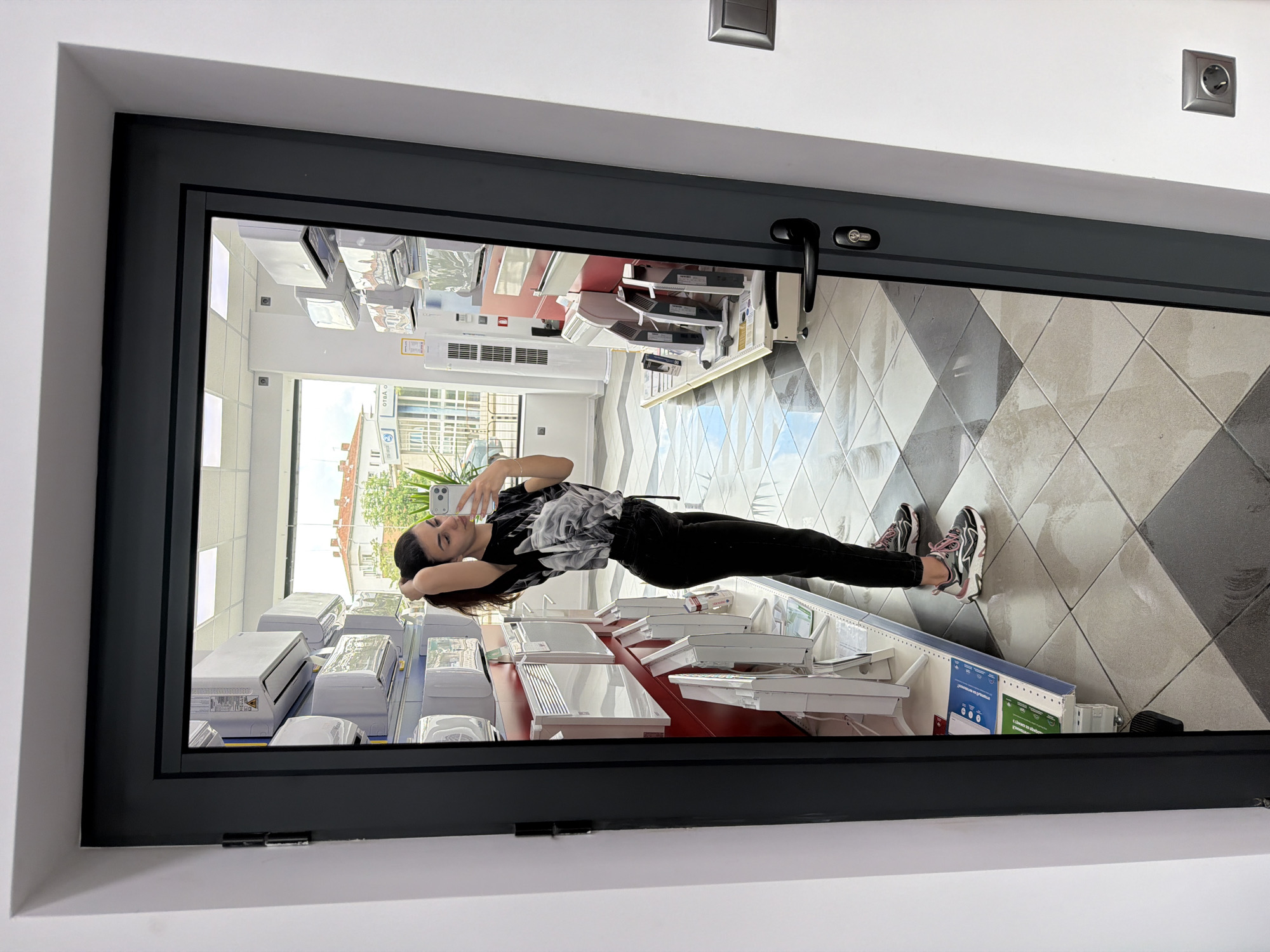 Woman takes selfies across multiple Gabrovo retail locations