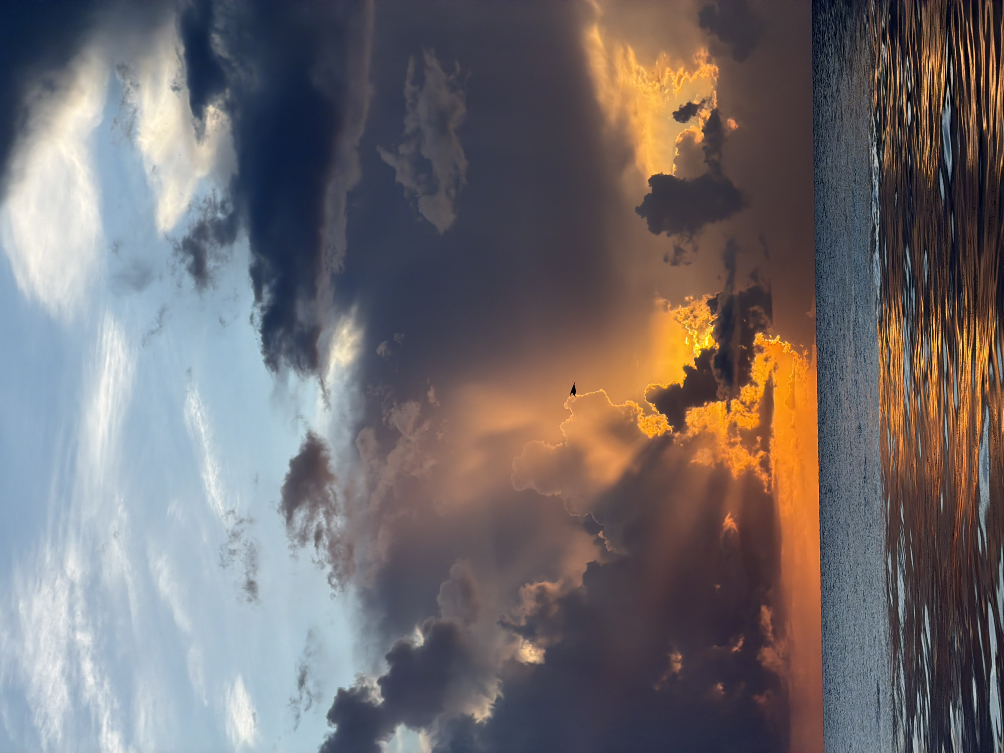 Storm clouds and sunlight collide over Miami Beach at sunset