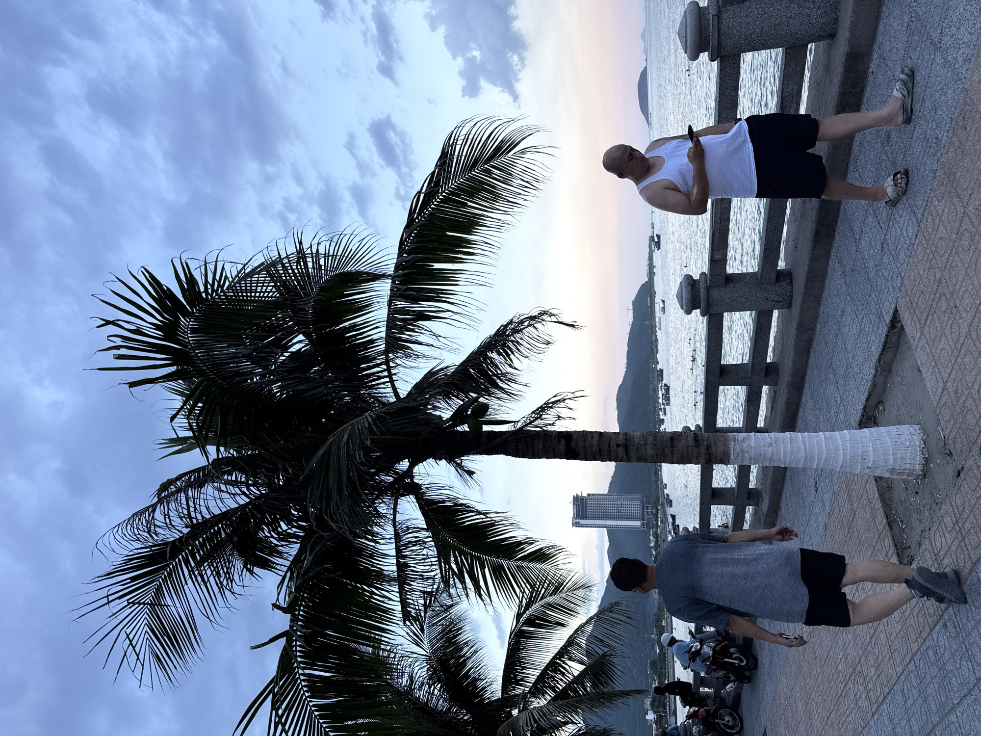 Nha Trang seafront morning: promenade life and coastal skies