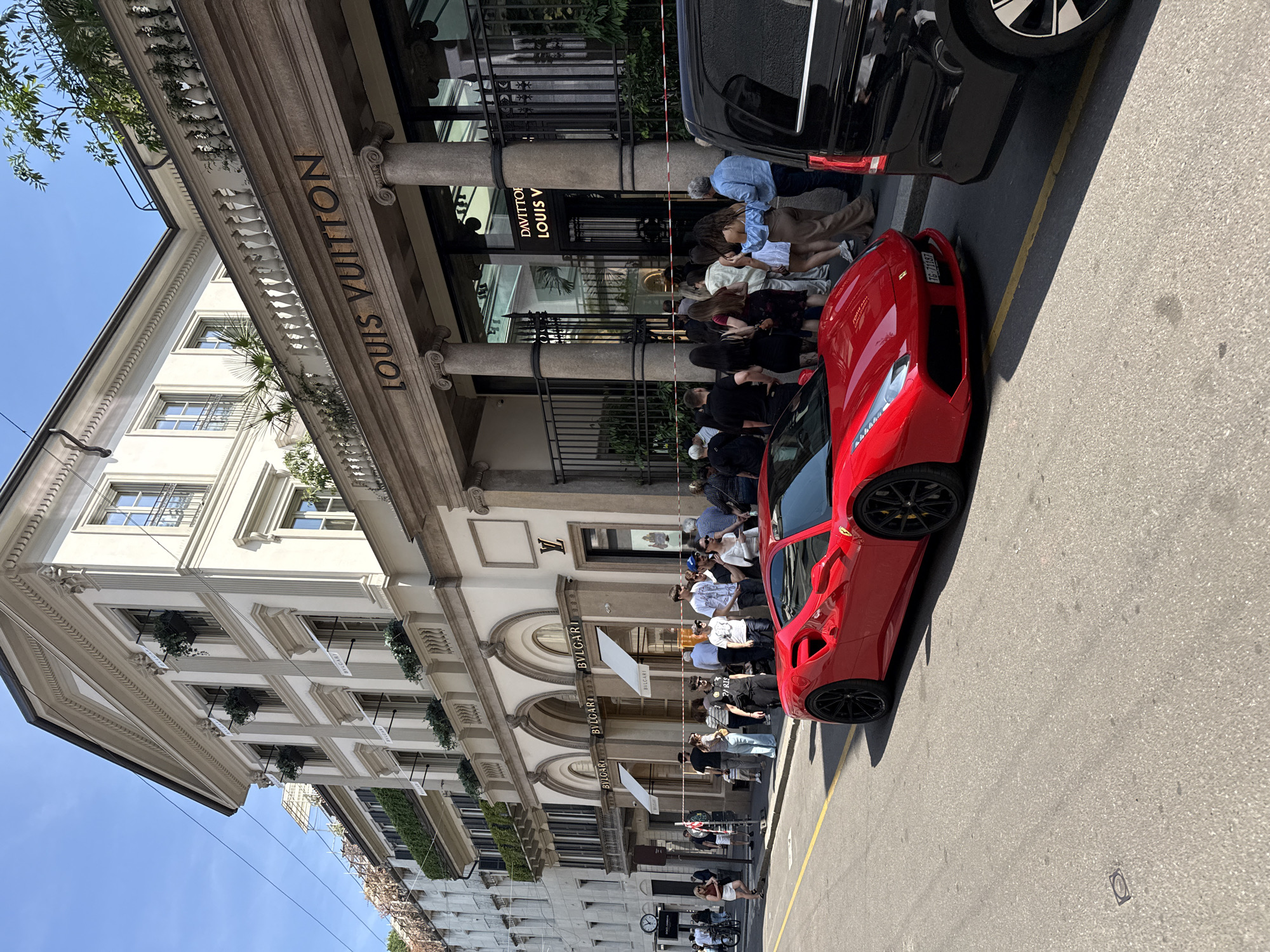 Luxury Lamborghinis parked outside Milan's high-end fashion district