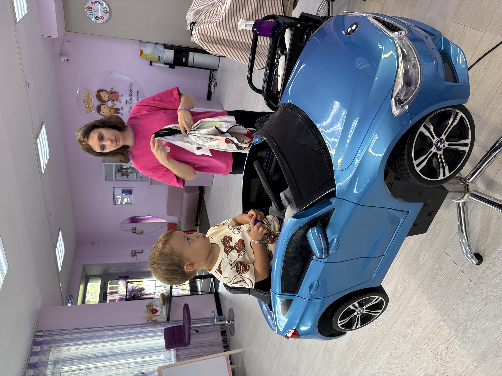 Toy car chair and cape at a Yaroslavl kids' salon