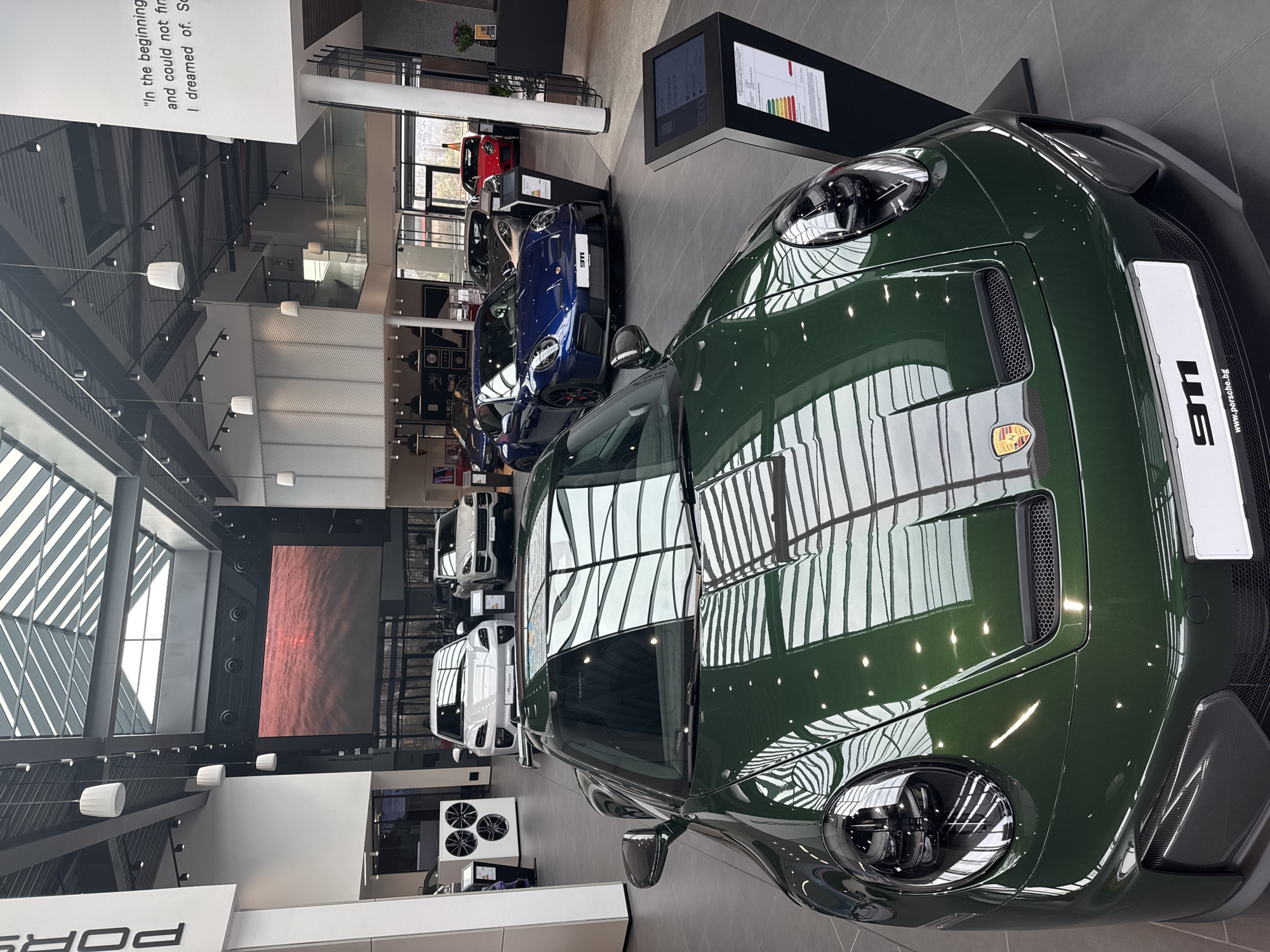 Green Porsche 911 displayed at Bulgaria dealership showroom
