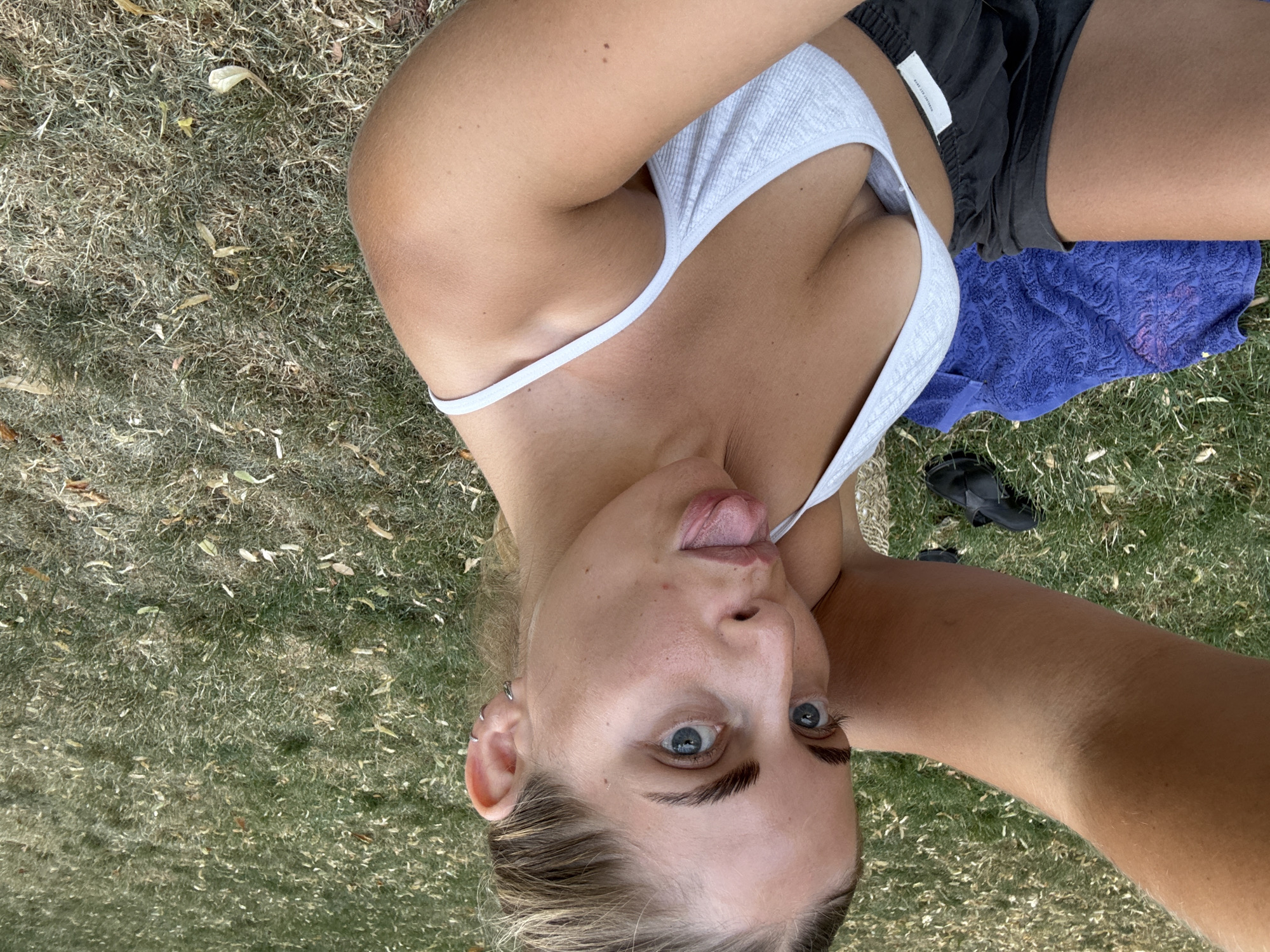 Playful grass selfies on a summer afternoon in Paris