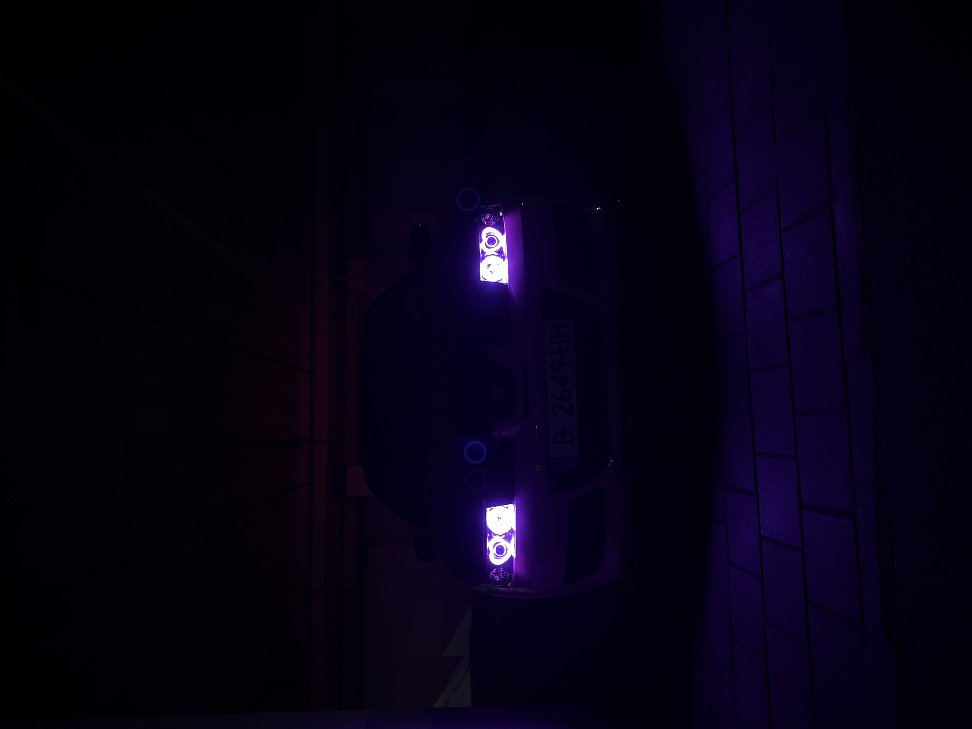 Car with violet headlights parked in Varna garage