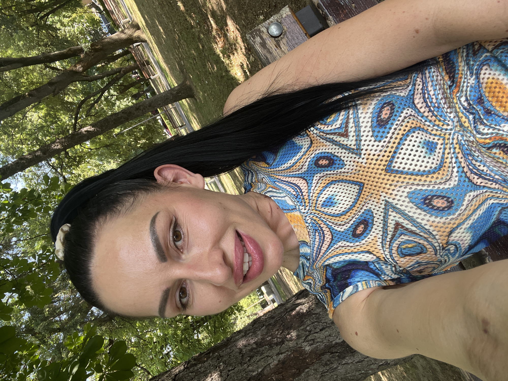 Relaxed afternoon at a tree-lined park with a water feature