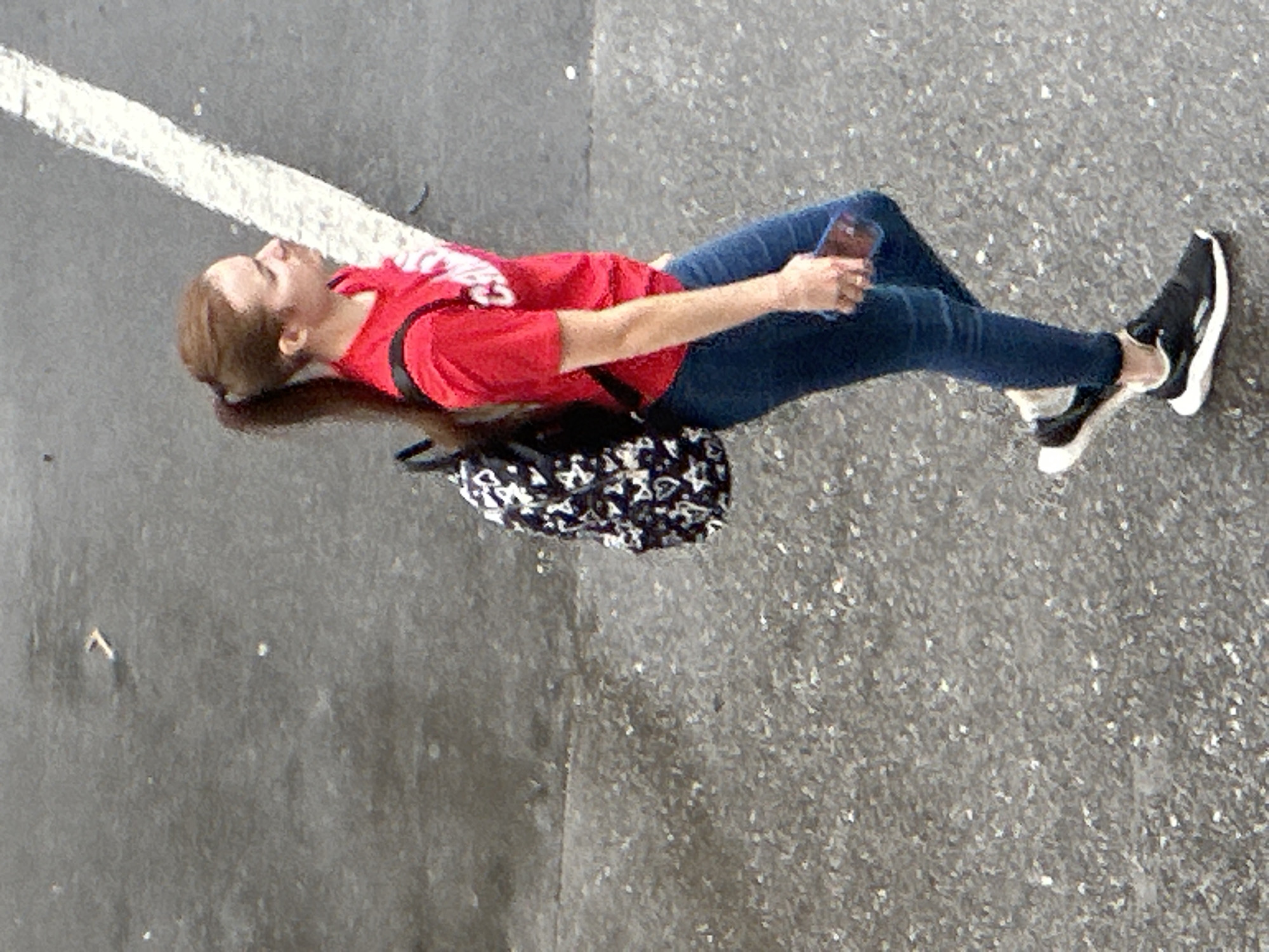 Everyday foot traffic along wet Podolsk streets and crosswalks