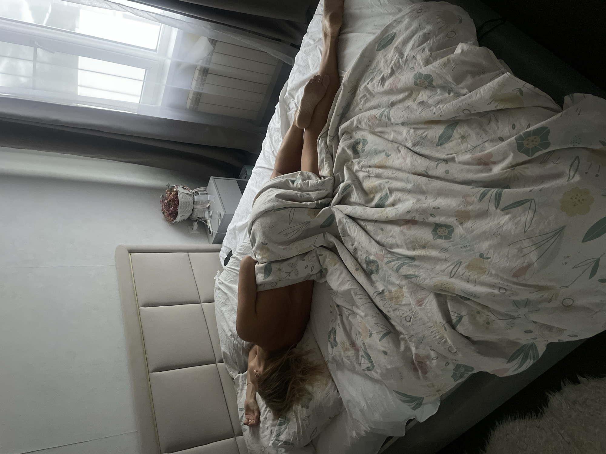 Woman resting in bed observed in Baranovka, Russia