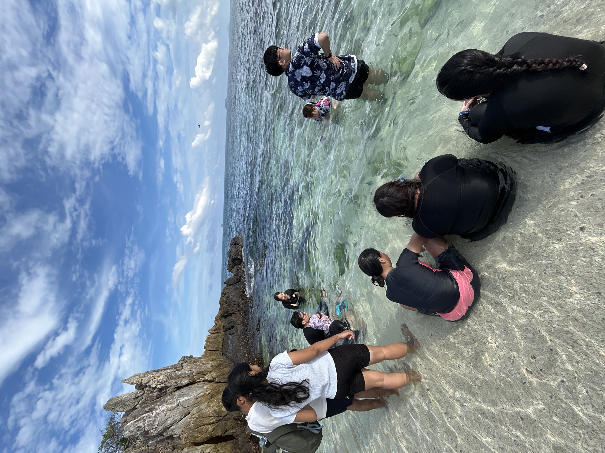 Family group enjoys morning at Phru Nai beach cove