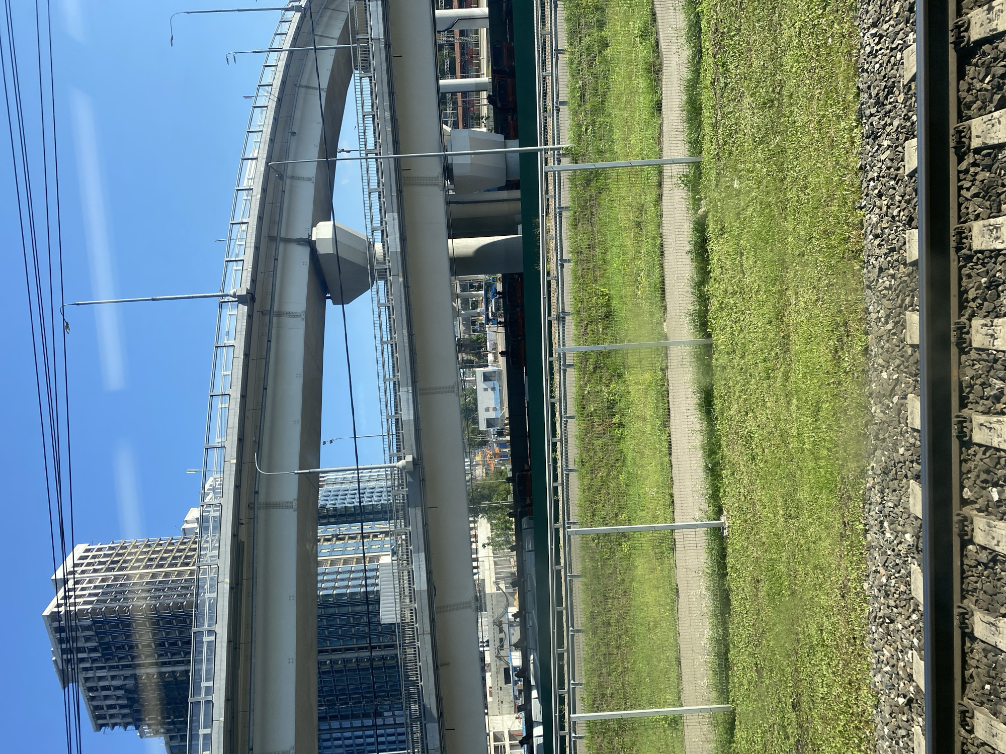 Train ride through a city of cranes, churches, and high-rises
