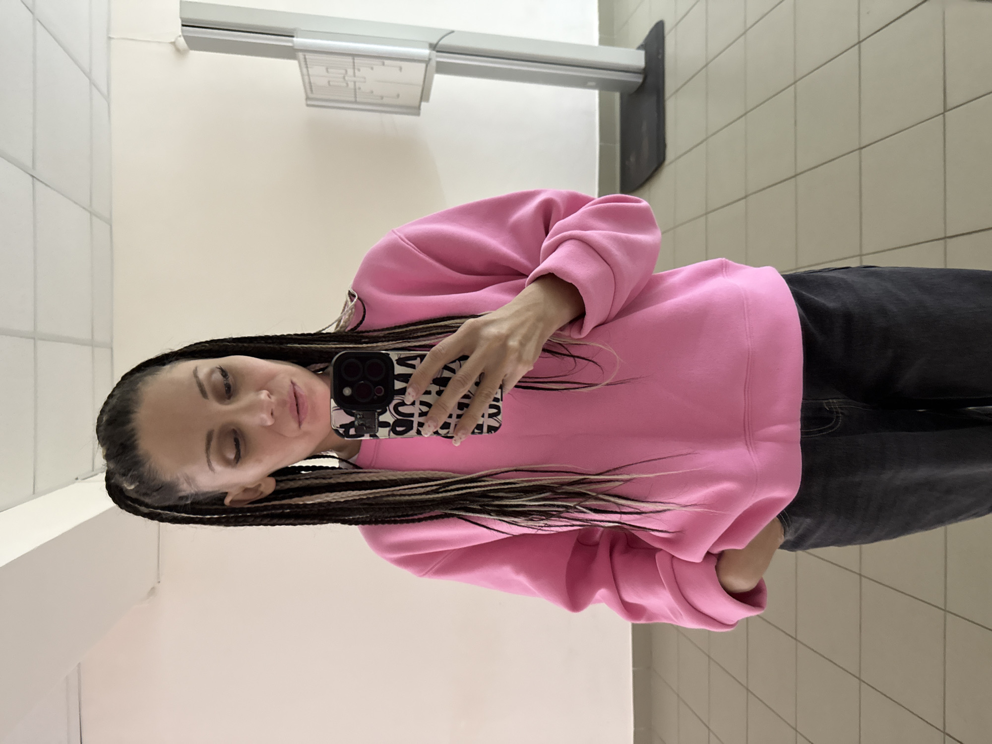 Woman in pink sweatshirt photographed at multiple Rusanovo locations