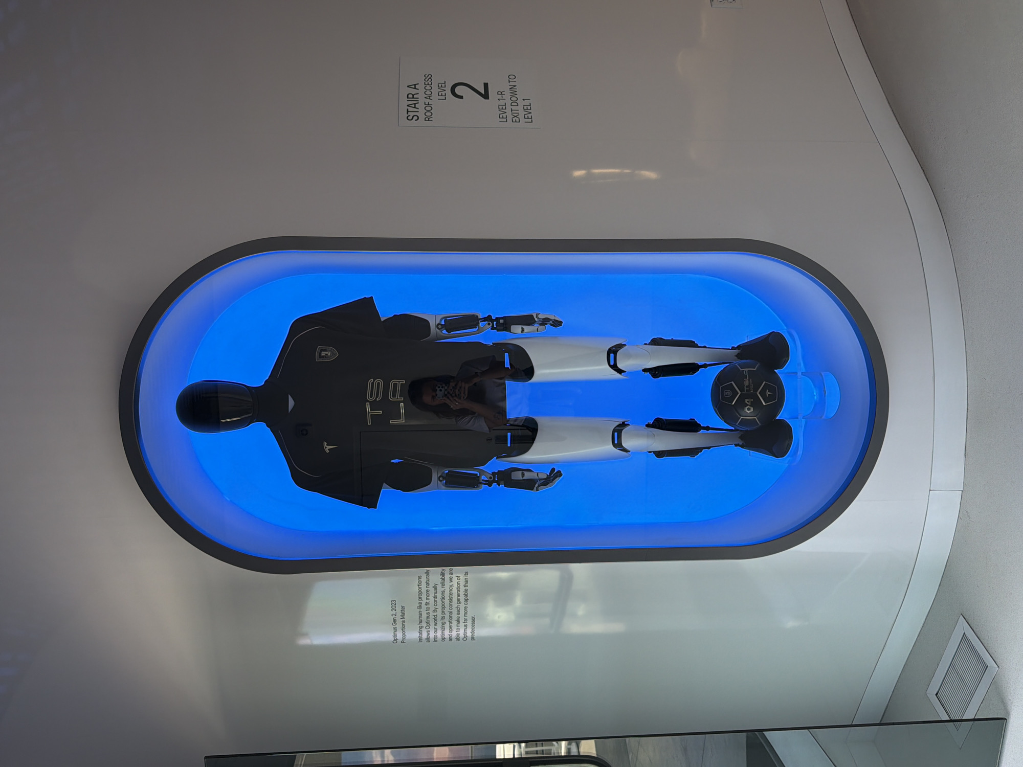 Tesla event in West Hollywood mixes robotics, EVs, and live racing screens