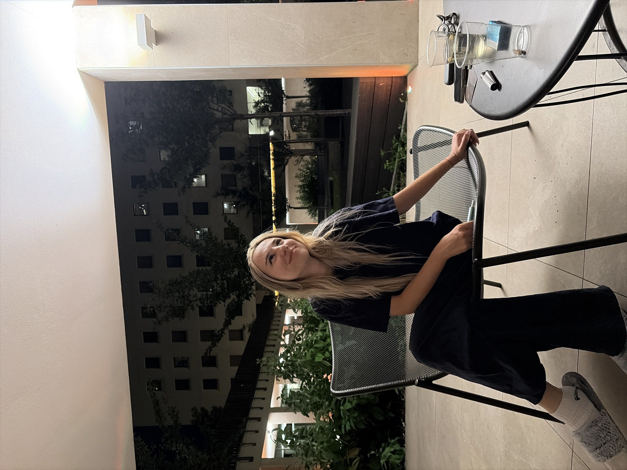 Evening in Milan: patio relaxation and elevator selfies