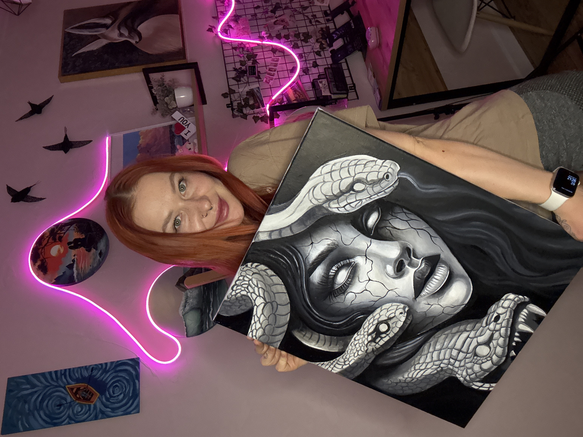 Woman poses with Medusa painting in Rostov-on-Don art space