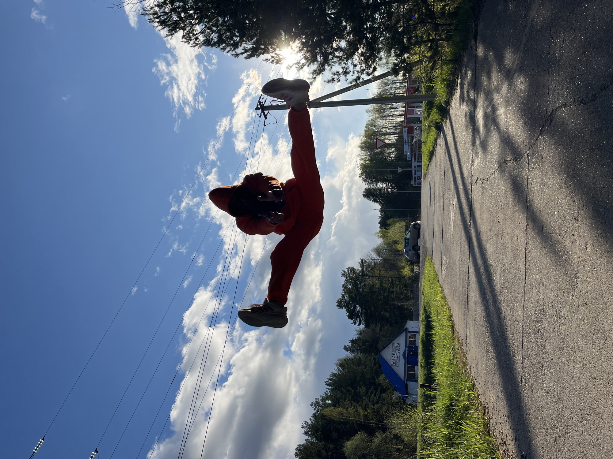 Person in Orange Explores Chaikovsky Russia During Afternoon Walk