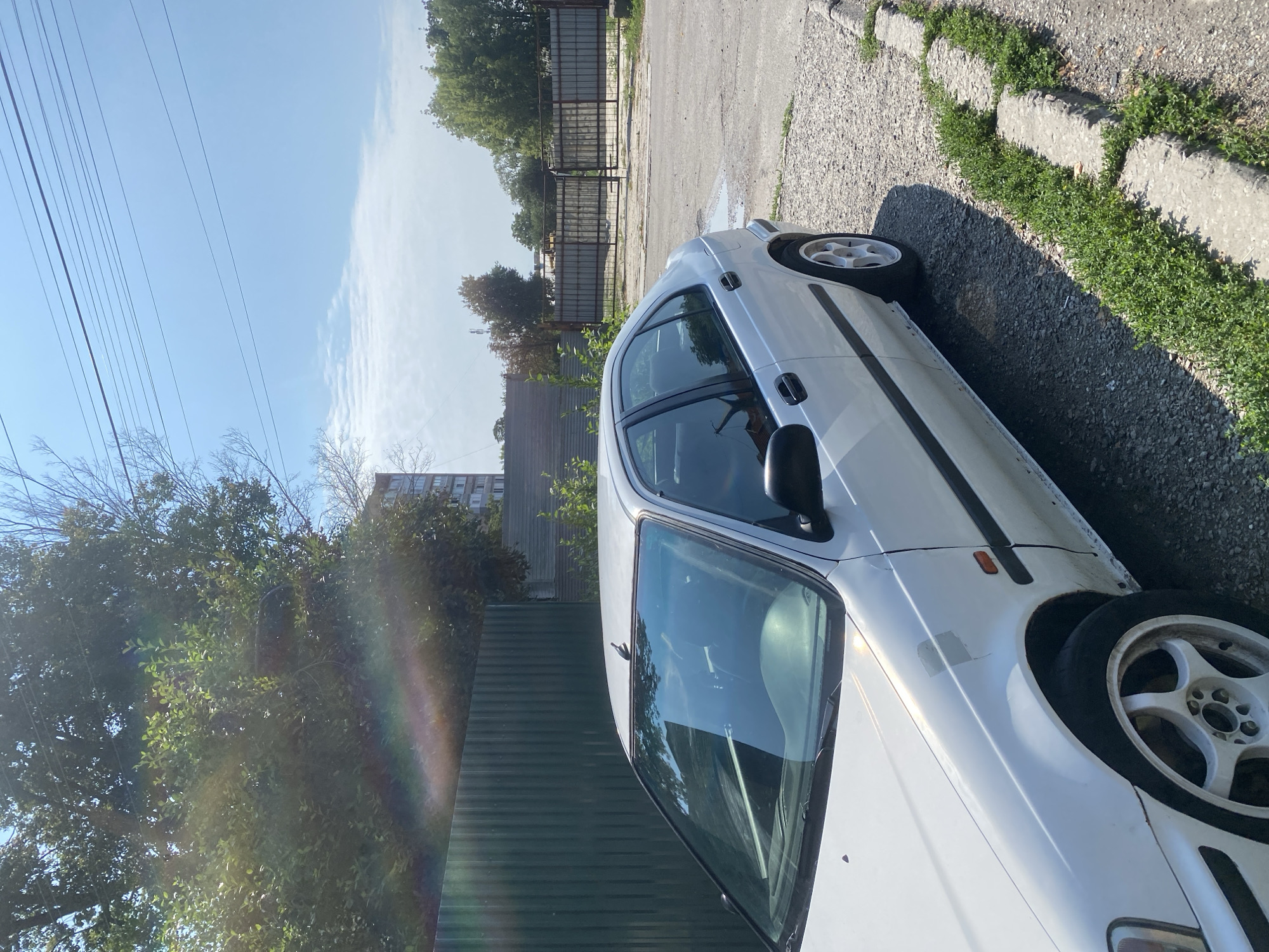 Quiet residential parking area in Poltava on an August morning