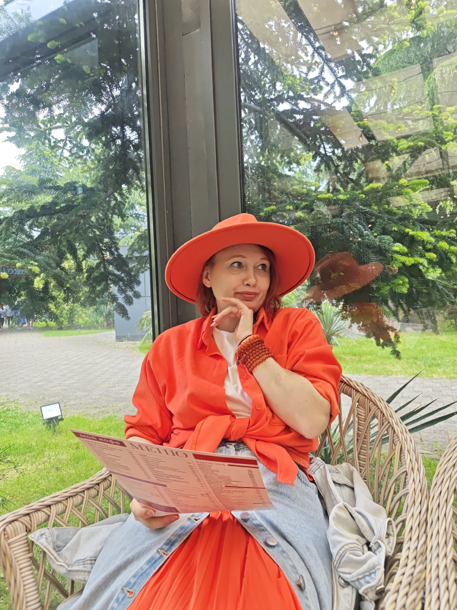 Woman in orange outfit spotted across multiple Sochi locations