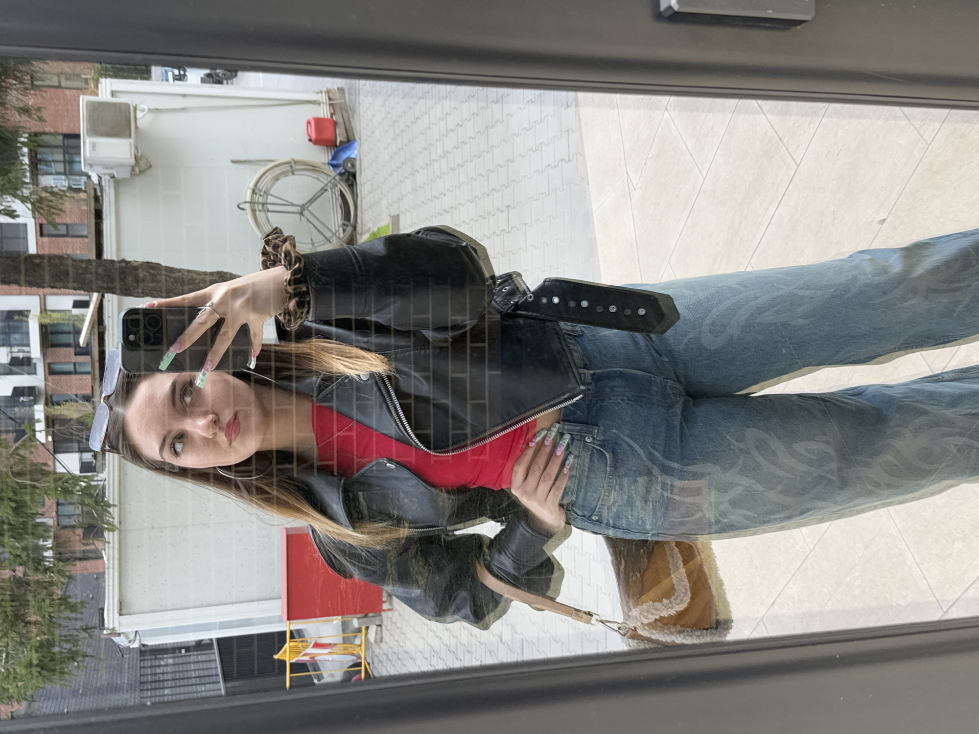 Two women captured in mirror reflection in Sofia